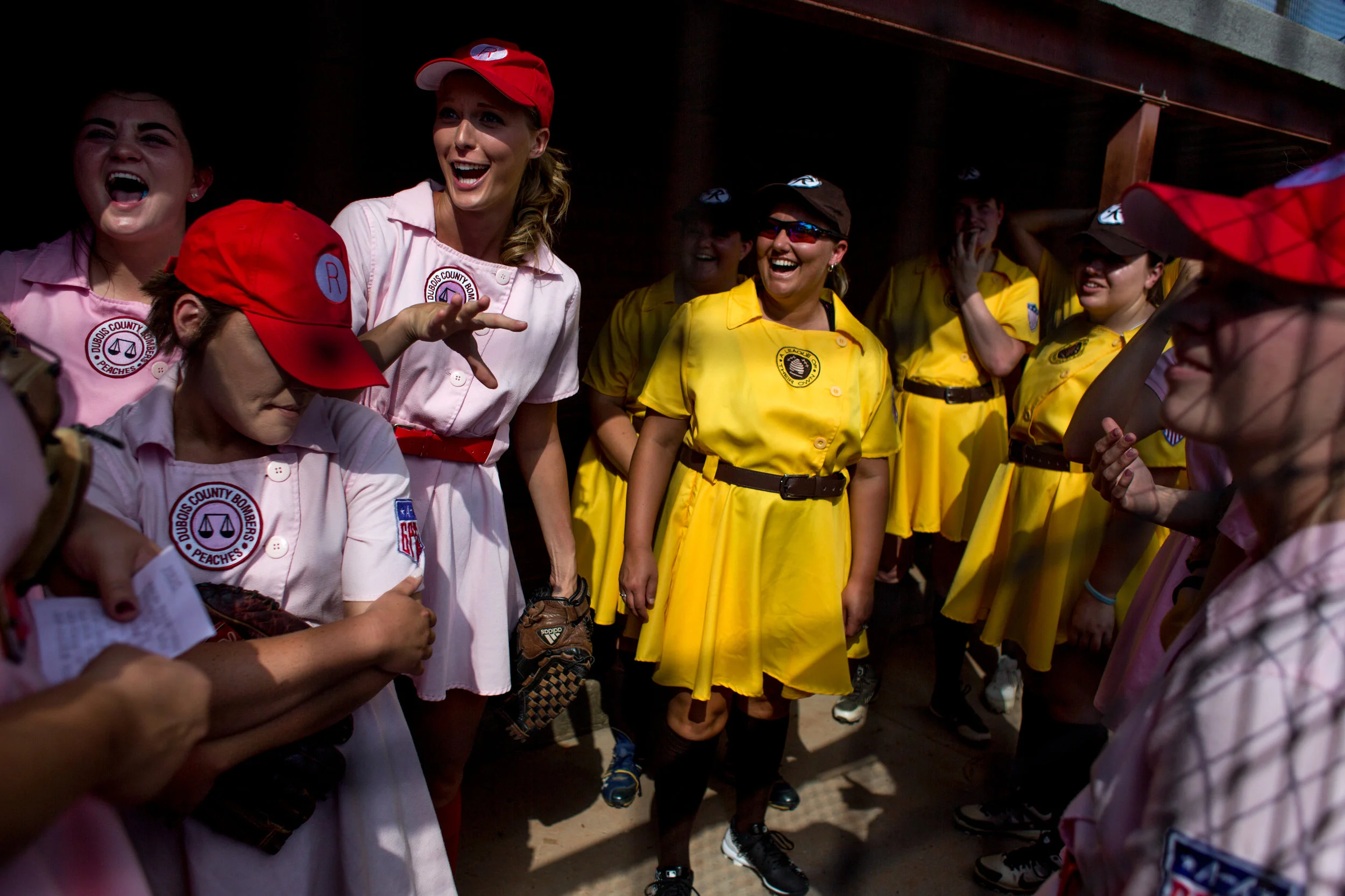 The Rockford Peaches and the Racine Belles chatted in the dugout together before playing at League Stadium on Saturday in Huntingburg during the 25th anniversary celebration of "A League of Their Own." The Peaches and Belles tied 8-8 during the 1940s-themed rematch.