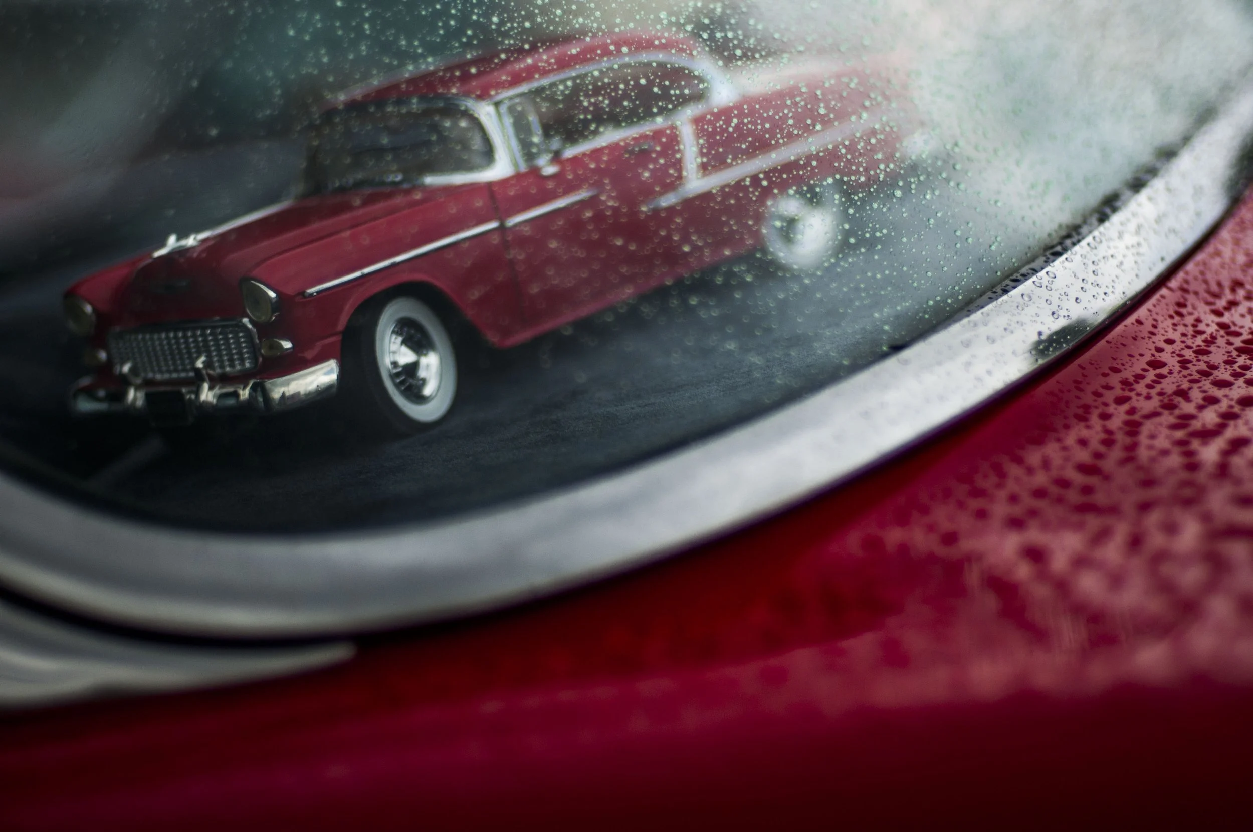 A miniature 1955 Chevrolet Bel Air sits in the window of Denny Vowell's 1955 Custom Chevrolet Bel Air during the Mount Morris Tune Up event in Mount Morris. The final tune up event offered an opportunity for the community to view a variety of classic