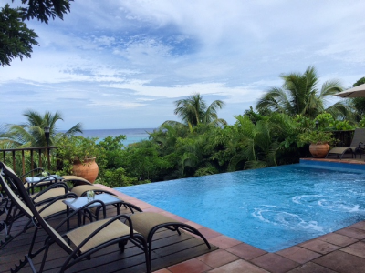 Relaxing by the pool at Mayoka Lodge, Roatan, Honduras.