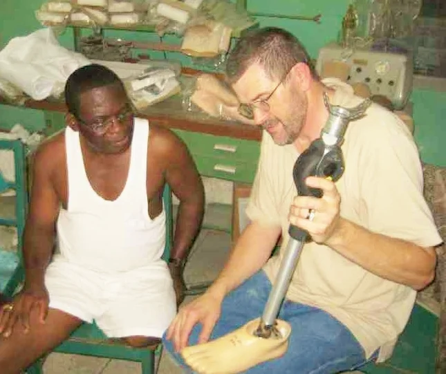 Kraig with patient in Ghana