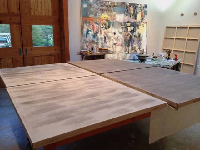Buller prepping his stretched Linen surfaces with Rabbit Skin glue.