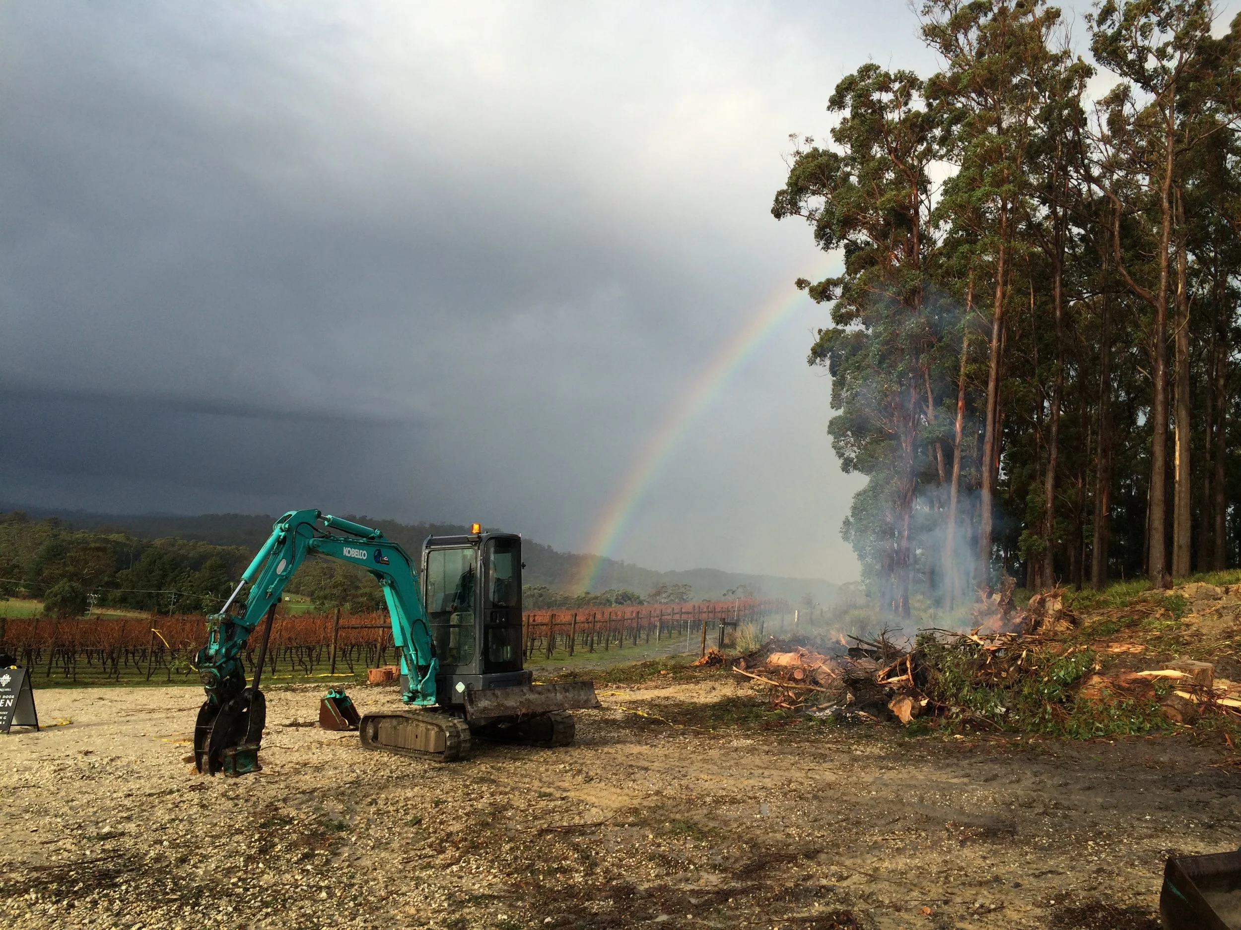 Digger with rainbow