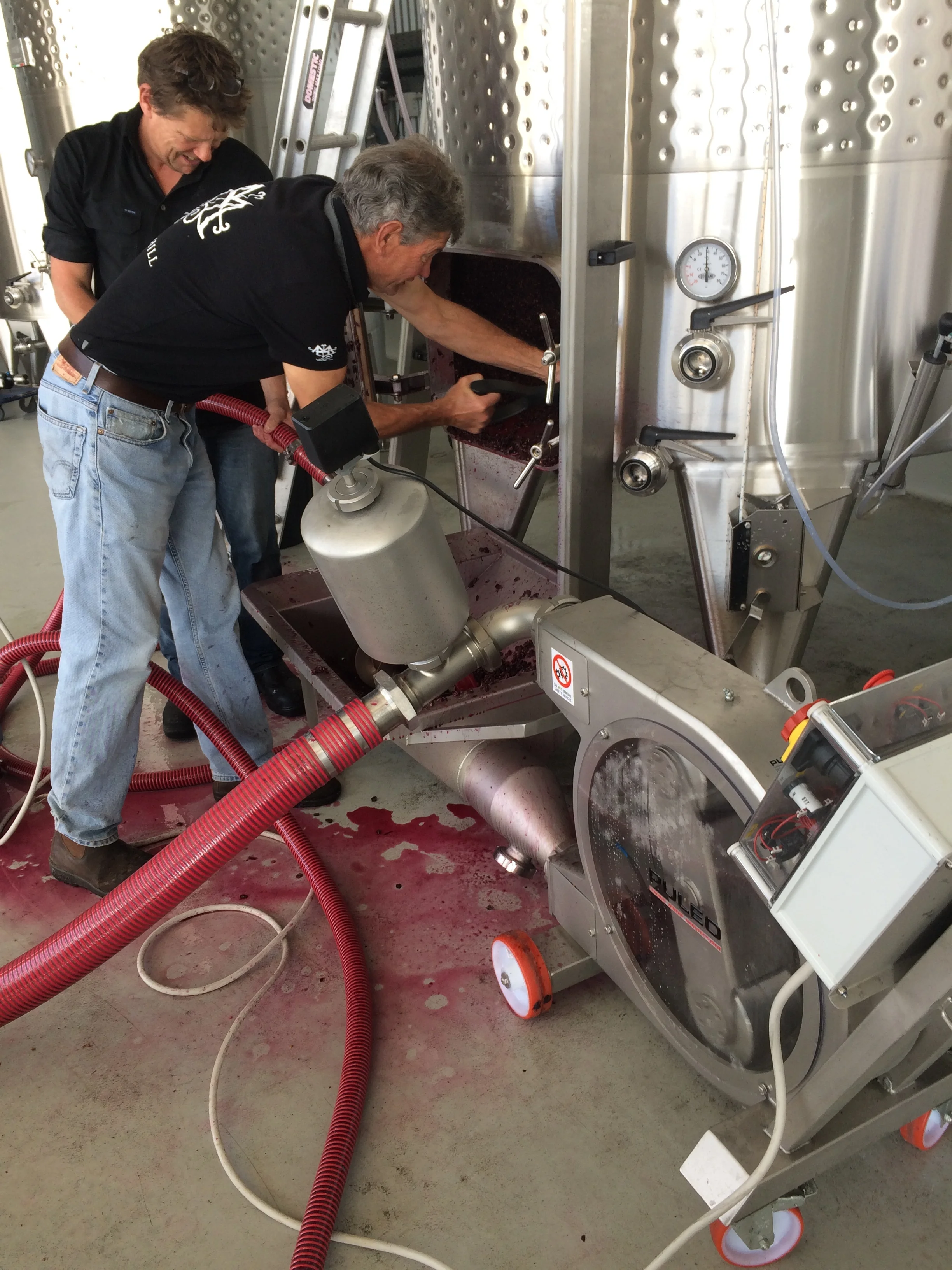Tim lends a hand in the messy job of cleaning a tank