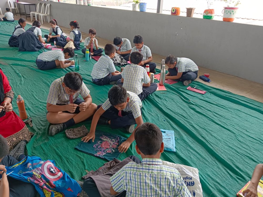   Getting creative in India!  Students of  Vasishtha GROUP of School  created envelopes using decorative materials from waste craft papers. They also repurposed used clothes into grocery bags. They were able to learn how recycling products reduces wa
