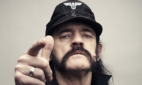Lemmy Kilmister of Motorhead demonstrates the frowny-face, nose-flared, badass look (aka the stink face or rock out face).