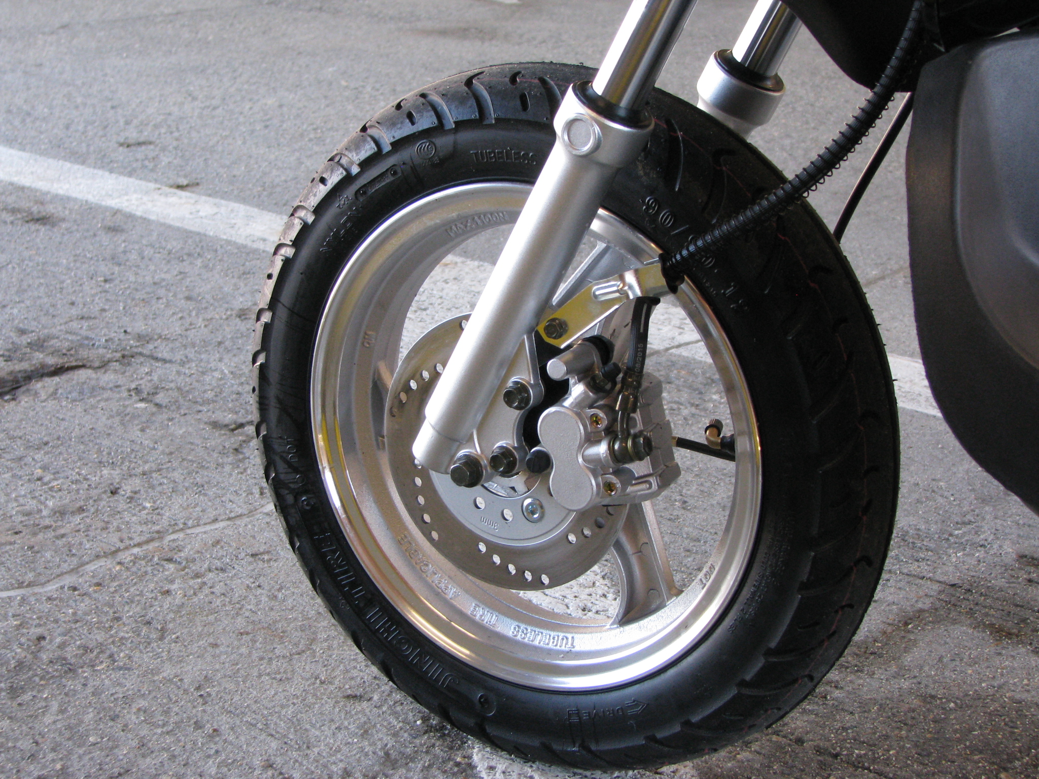 The Ruckus clones feature a 12" street tire with hydraulic disc brake up front - this setup will handle better than the genuine Ruckus out on the road.