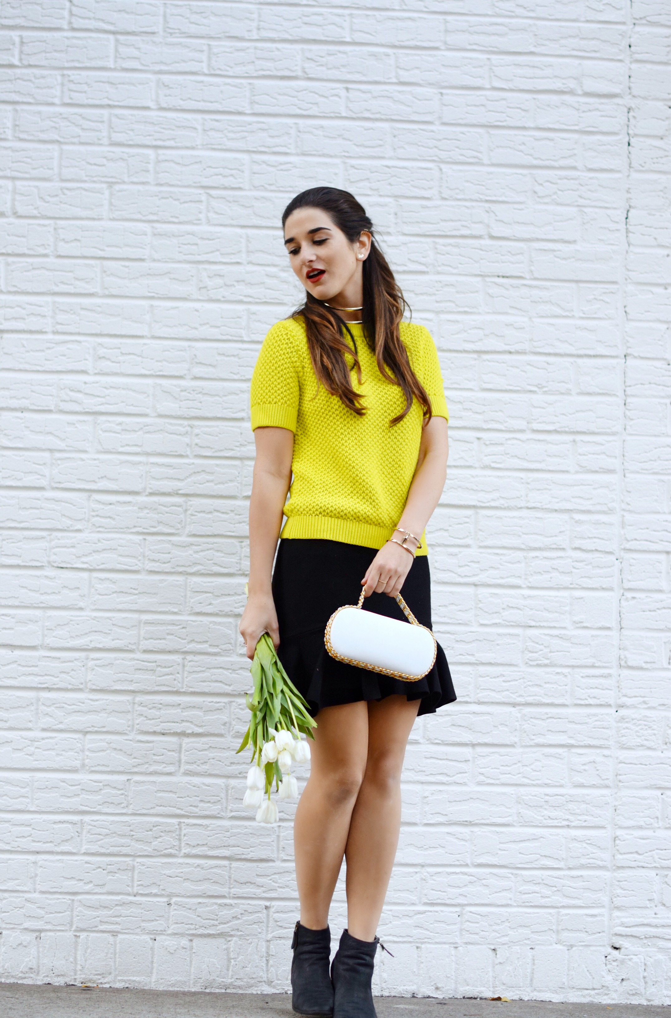 White Prince Minaudiere Erin Dana Louboutins & Love Fashion Blog Esther Santer NYC Street Style Blogger Bag Giveaway Gold Jewelry Lydell Bracelet Collar Necklace Black Booties Flared Ruffle Skirt Photoshoot Model Club Monaco Neon Yellow Sweater Outfit.jpg
