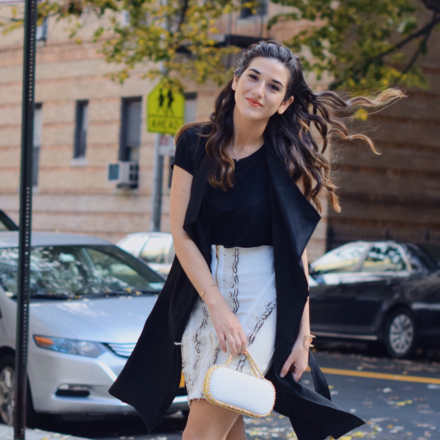 White Feather Skirt Long Black Vest Wow Couture Louboutins & Love Fashion Blog Esther Santer NYC Street Style Blogger Photoshoot Hairstyle Inspo Heels Gold Black Tee Zara Outfit OOTD Beauty Girl Women Model Fall Winter Look Erin Dana White Minaudiere.JPG