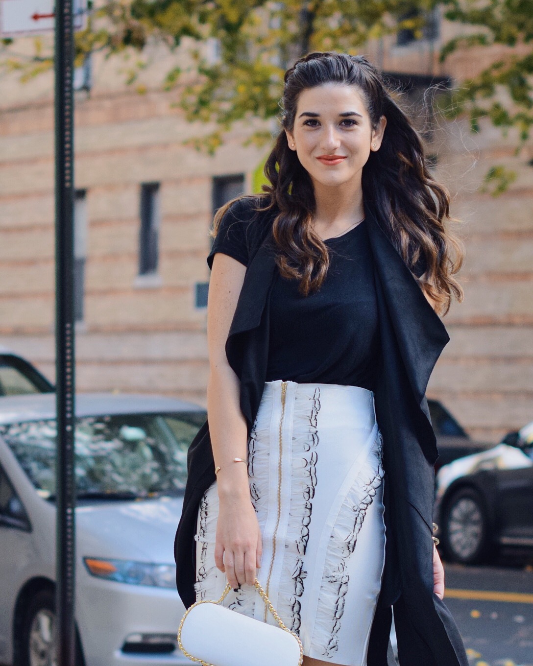 White Feather Skirt Long Black Vest Wow Couture Louboutins & Love Fashion Blog Esther Santer NYC Street Style Blogger Photoshoot Hairstyle Inspo Heels Gold Black Tee Zara Outfit OOTD Beauty Winter Fall Braid Girl Women Model Erin Dana White Minaudiere.JPG