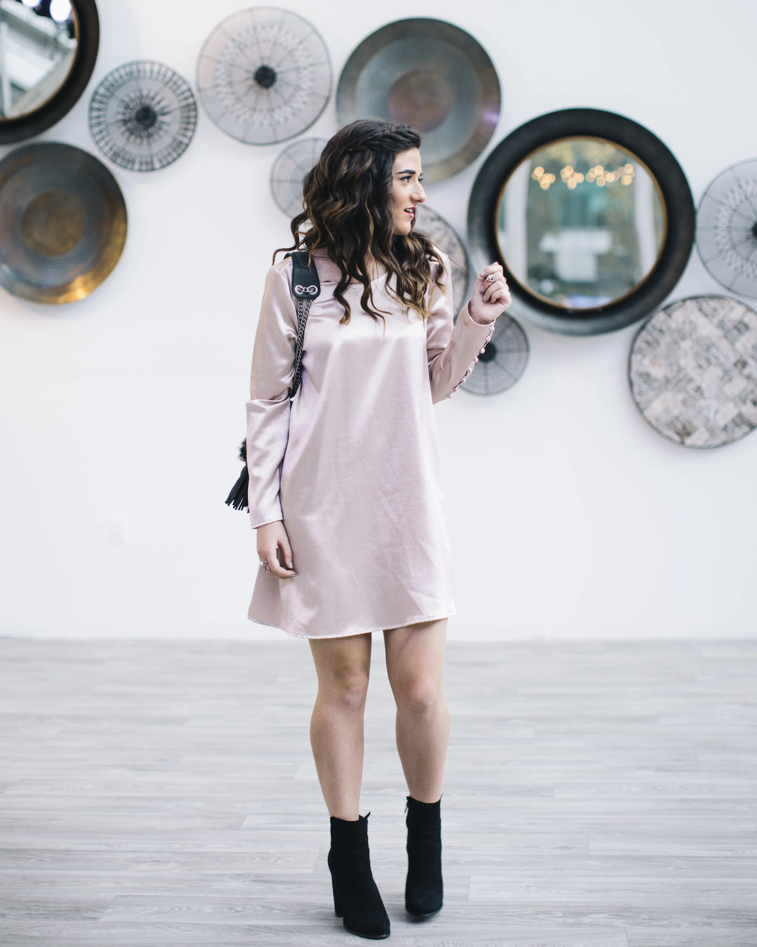 light pink dress with black heels Soft pink dress + black heels = the combo that hits every single time   The chiffon ribbon detail and gold brooch are giving extra points we did  NOT ask for 