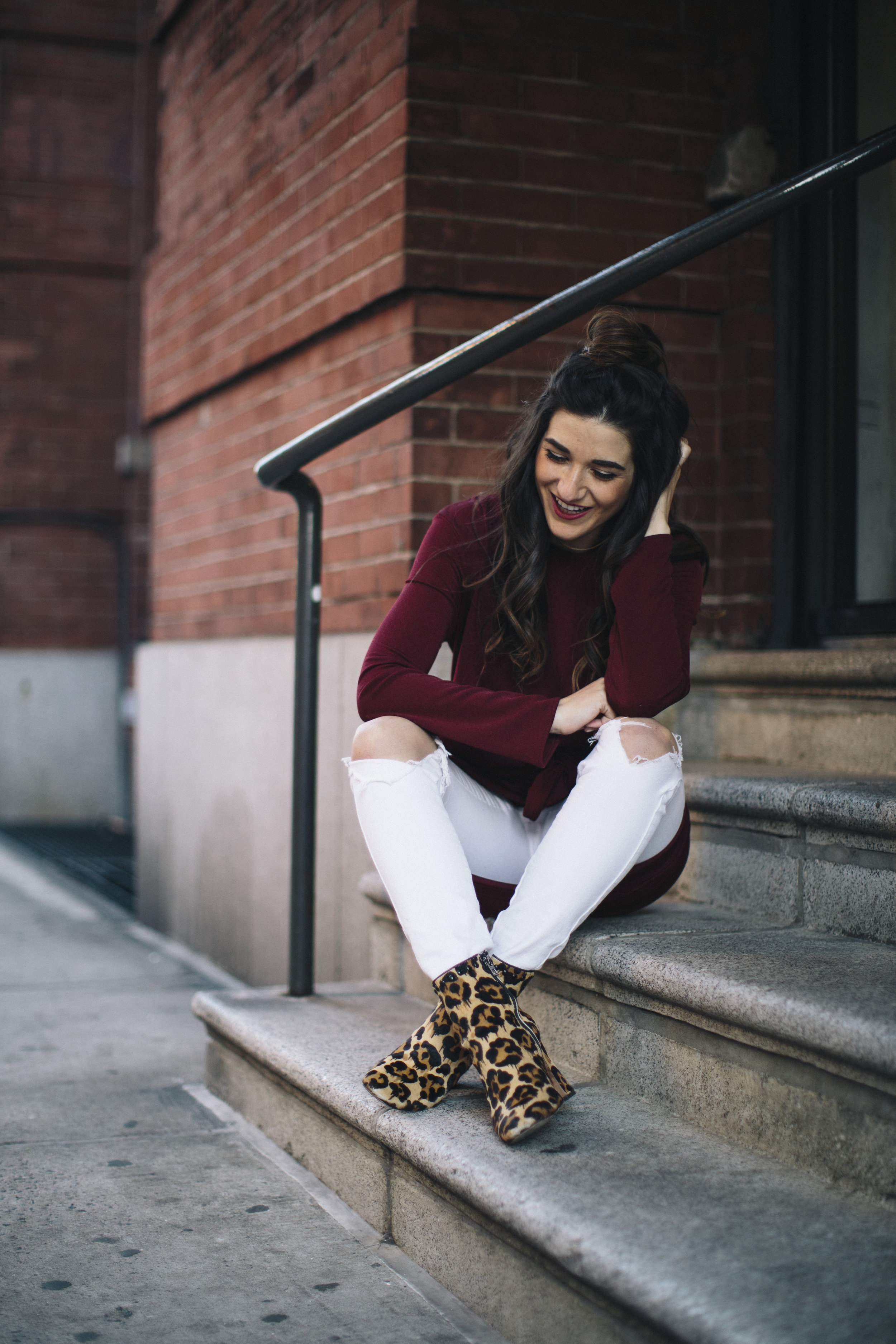 Knotted Dress + Ripped White Jeans 4 Ways To Build Connections Louboutins & Love Fashion Blog Esther Santer NYC Street Style Blogger Outfit OOTD Trendy Red Maroon Burgundy Winter Color Leopard Coach Booties Pants Girl Women Topknot Bun Hair Shoes Wear.jpg