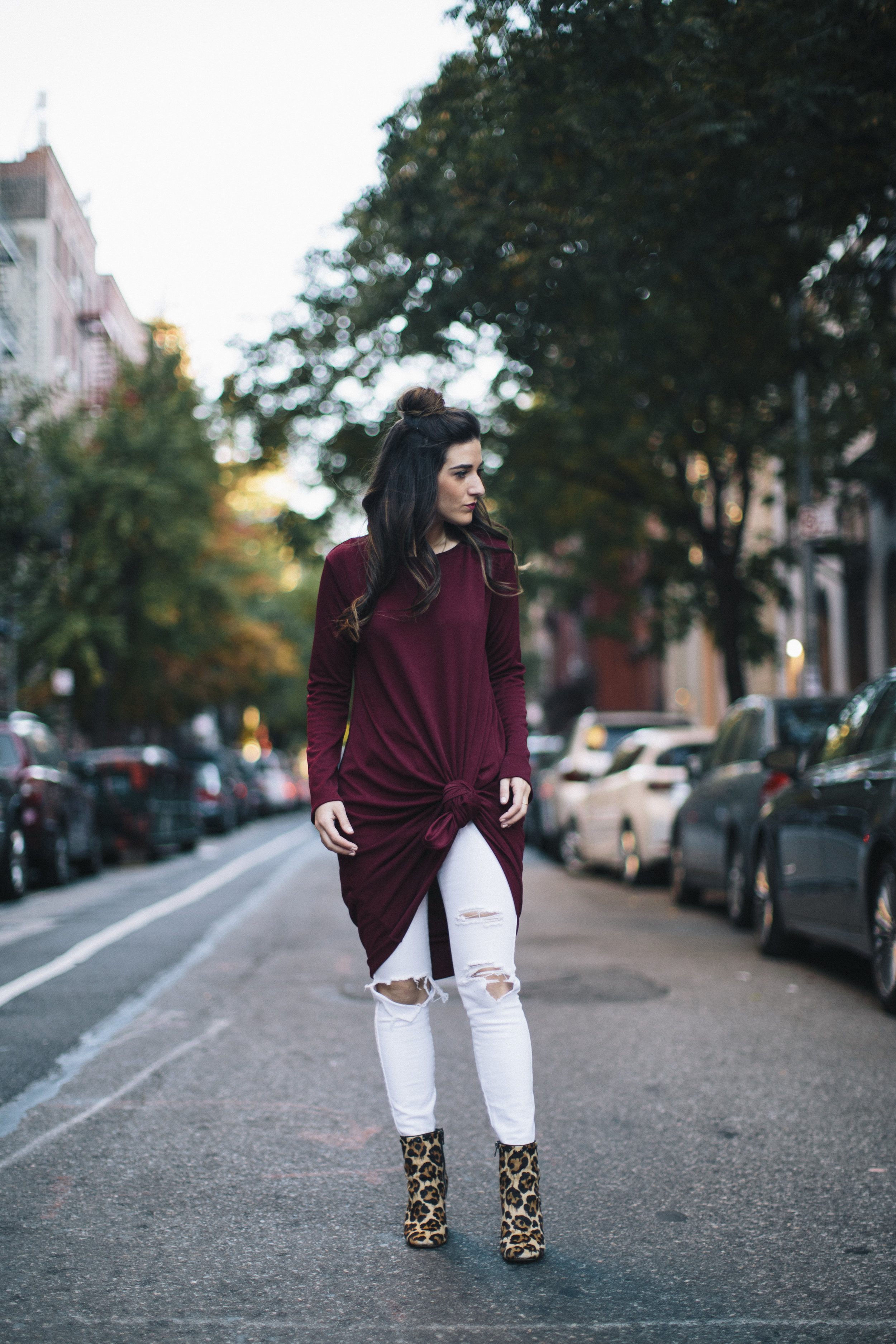 Knotted Dress + Ripped White Jeans 4 Ways To Build Connections Louboutins & Love Fashion Blog Esther Santer NYC Street Style Blogger Outfit OOTD Trendy Red Maroon Burgundy Winter Color Leopard Coach Shoes Booties Pants Girl Women Topknot Bun Hair Wear.jpg