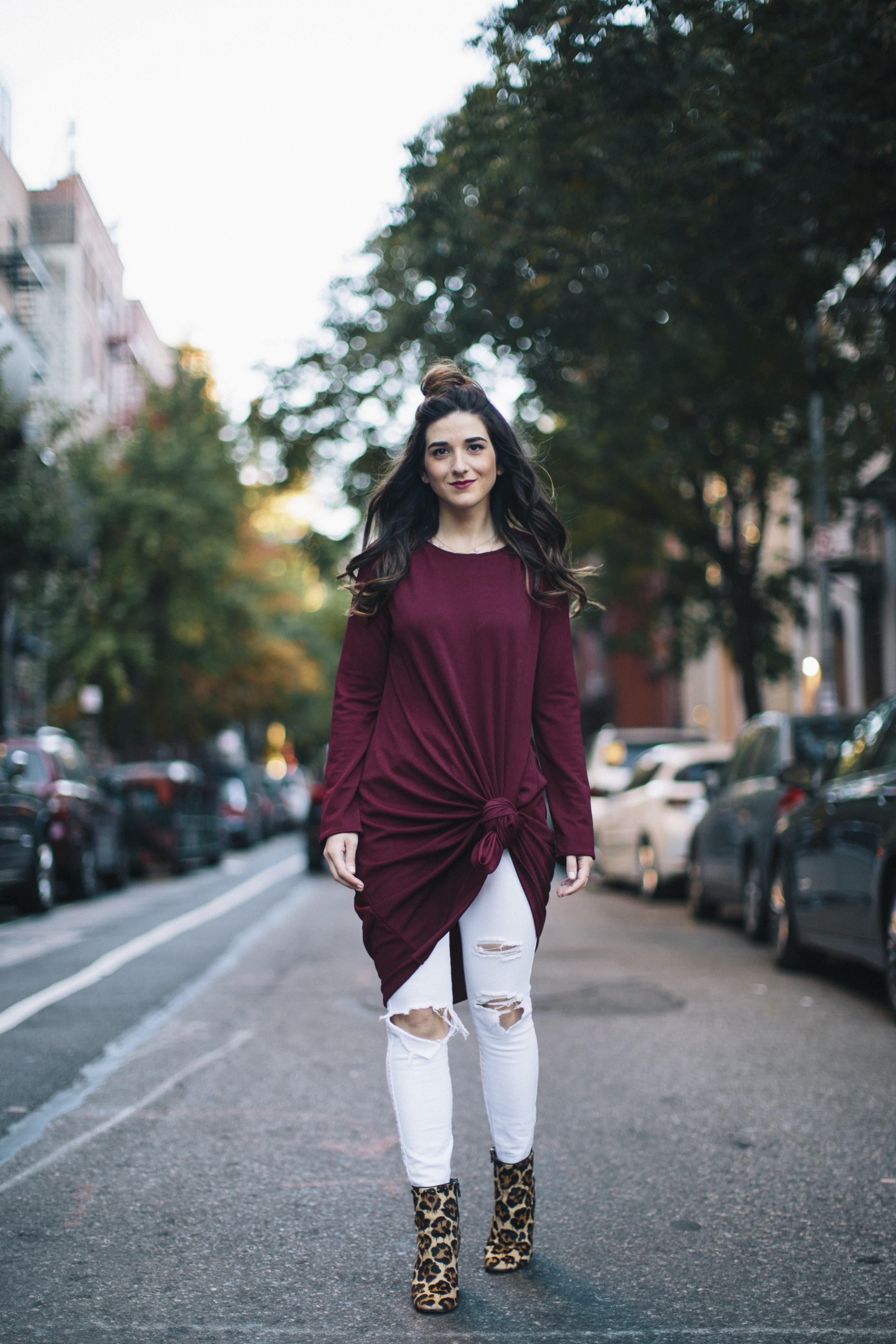 Knotted Dress + Ripped White Jeans 4 Ways To Build Connections Louboutins & Love Fashion Blog Esther Santer NYC Street Style Blogger Outfit OOTD Trendy Red Maroon Burgundy Winter Wear Color Leopard Coach Shoes Booties Pants Topknot Hair Bun Women Girl.jpg