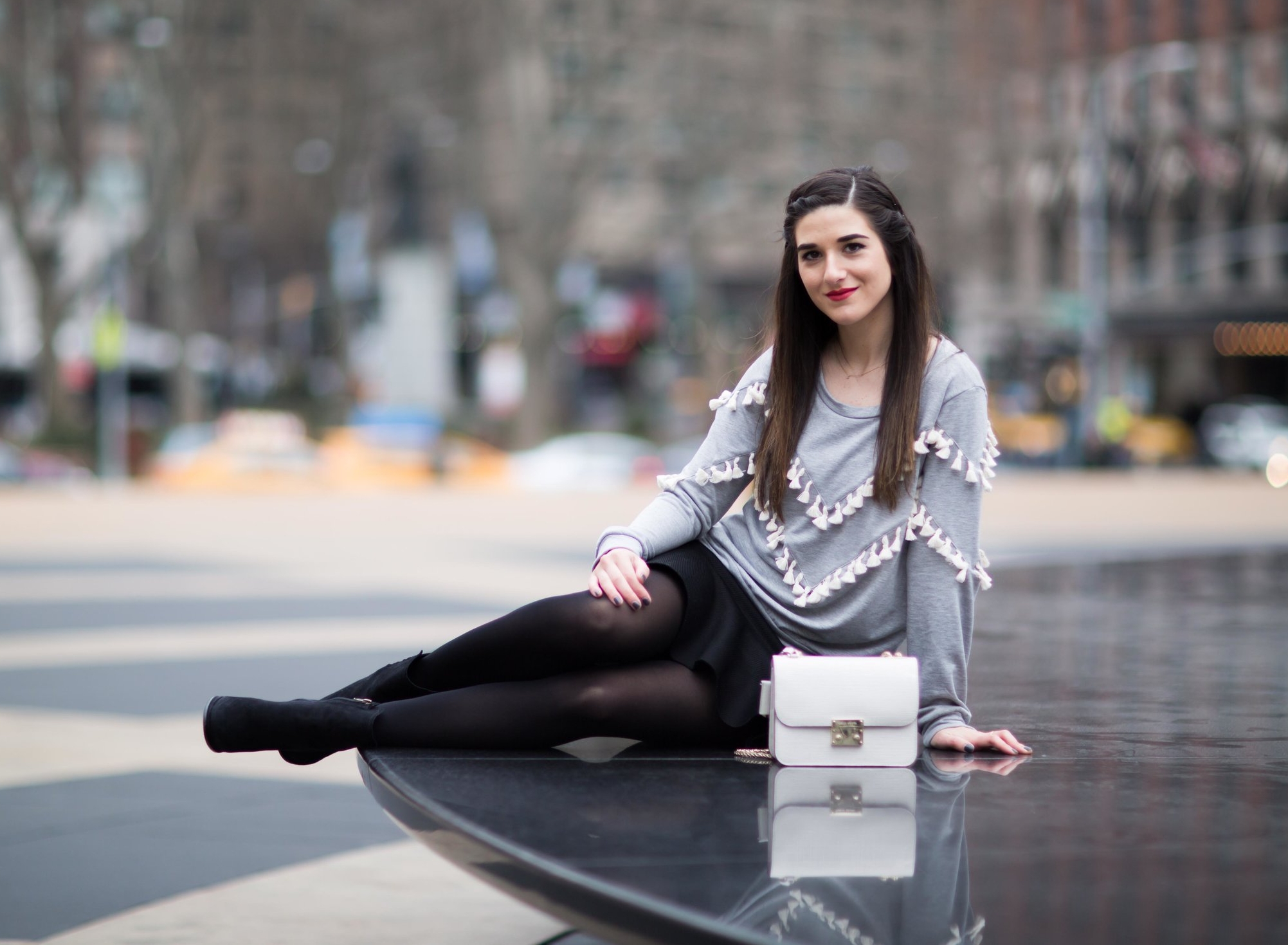 Grey Tassel Sweatshirt Everything You Wanted To Know About Blog Interns Esther Santer Fashion Blog NYC Street Style Blogger Outfit OOTD  Trendy Henri Bendel Waldorf Party Bag Black Mini Skirt Booties Shoes Cozy Tights Photoshoot Model Girl Women Hair.jpg