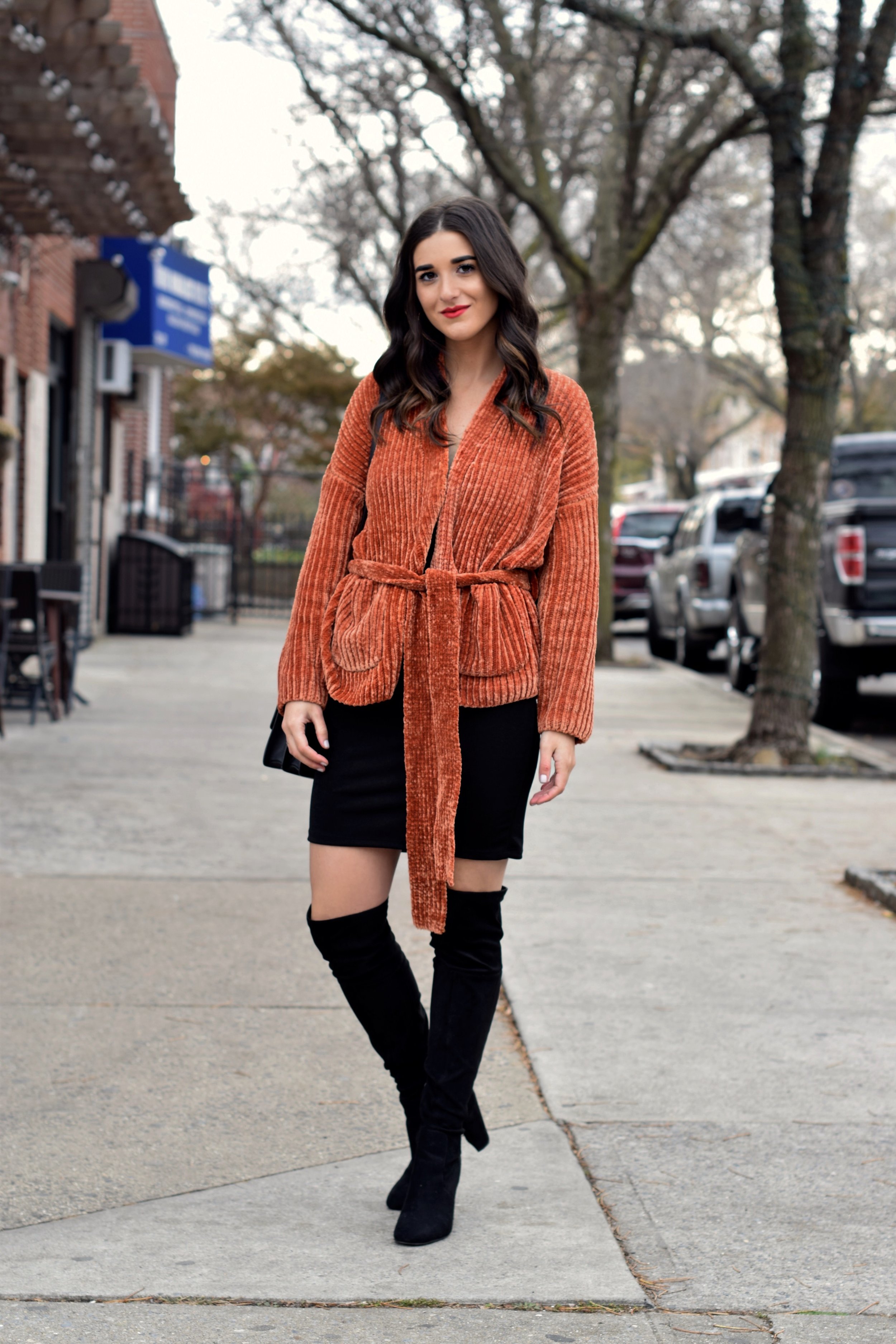 Orange Tie Sweater OTK Boots 10 Sweaters That Make The Perfect Holiday Gifts Esther Santer Fashion Blog NYC Street Style Blogger Outfit OOTD Trendy Urban Outfitters Girl Women Black Over The Knee Boots Slip Dress Beautiful New York City  Cozy OOTD.jpg