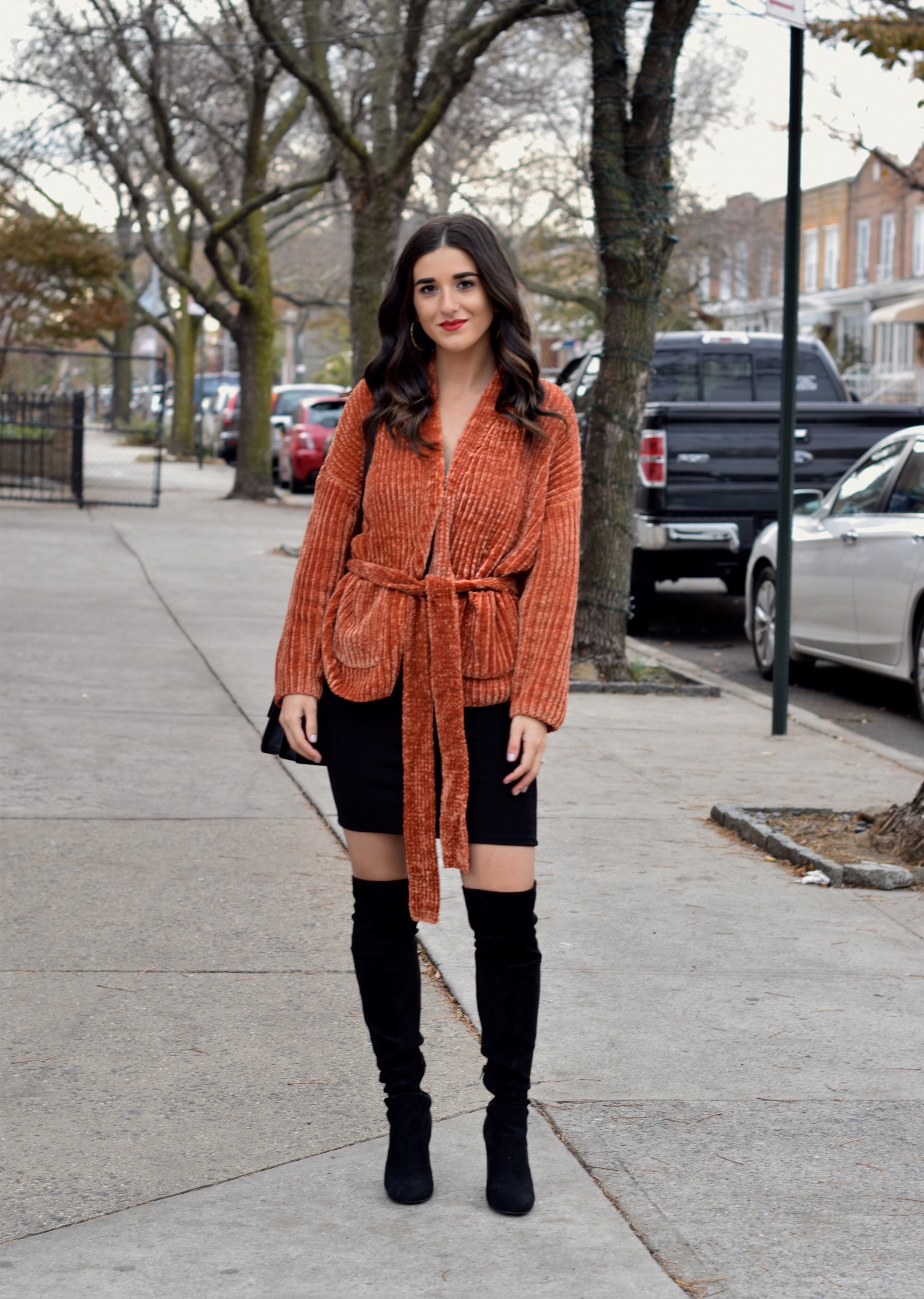 Orange Tie Sweater OTK Boots 10 Sweaters That Make The Perfect Holiday Gifts Esther Santer Fashion Blog NYC Street Style Blogger Outfit OOTD Trendy Urban Outfitters Girl Women Black Over The Knee  Boots Slip Dress Beautiful New York City Cozy OOTD.jpg