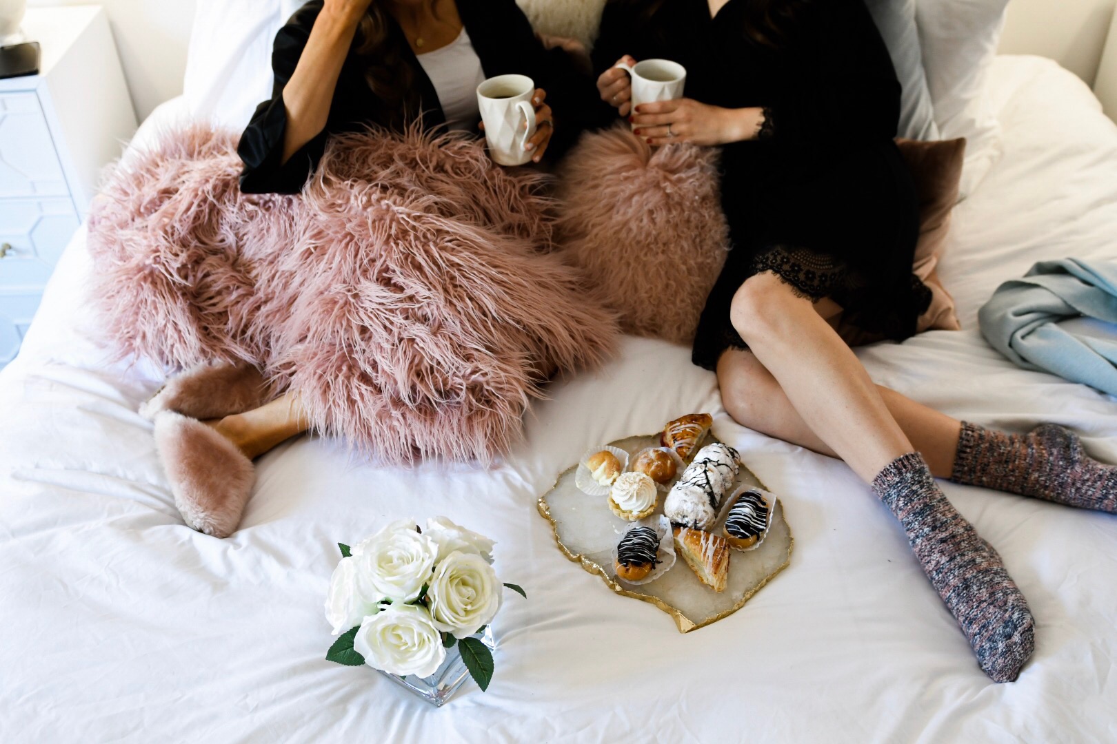 Girls' Night In With Valour Magazine Esther Santer Fashion Blog NYC Street Style Blogger Outfit OOTD Trendy Eishes Style Cozy Blanket Throw Pillows Flowers Desserts Pastries Black Robes Pink Fur Fuzzy Slippers Jcrew Adore  Me Socks Mugs Coffee Women.jpg