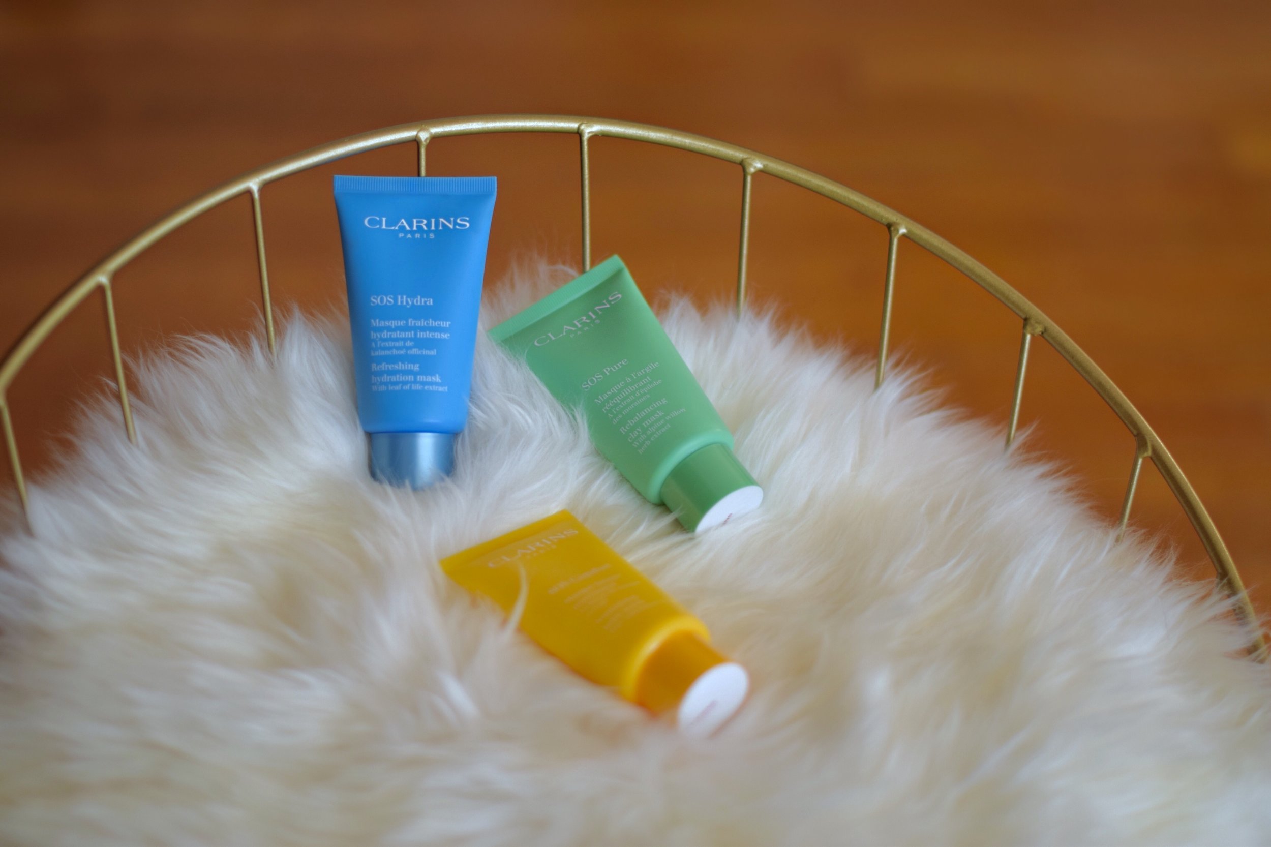 SOS Face Masks Clarins Esther Santer Fashion Blog NYC Street Style Blogger Outfit OOTD Trendy Beauty Product Review Colorful Blue Green Yellow Bottle Moisturize Masque Rebalancing Shop Skincare Skin Routine Comfort Girl Women New York City  Hydrate.jpg