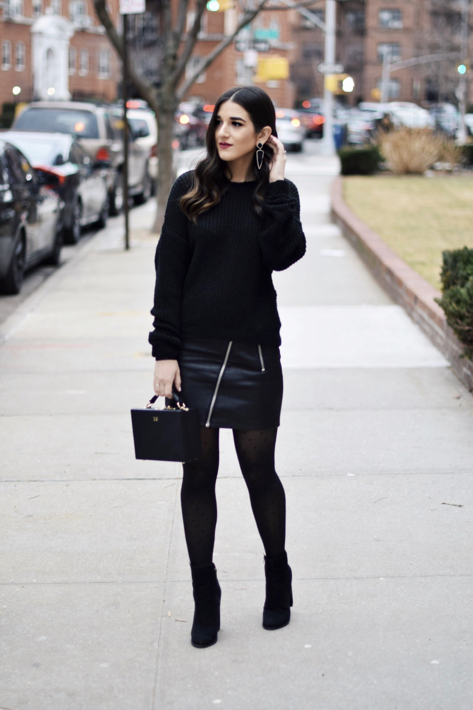 All Black Look 5 Ways To Keep Your New Year's Resolution Going Strong Esther Santer Fashion Blog NYC Street Style Blogger Outfit OOTD Trendy BaubleBar Earrings Monogrammed Box Bag  Daily Edited Girl Women Booties Pleather Mini Skirt Polka Dot Tights.jpg