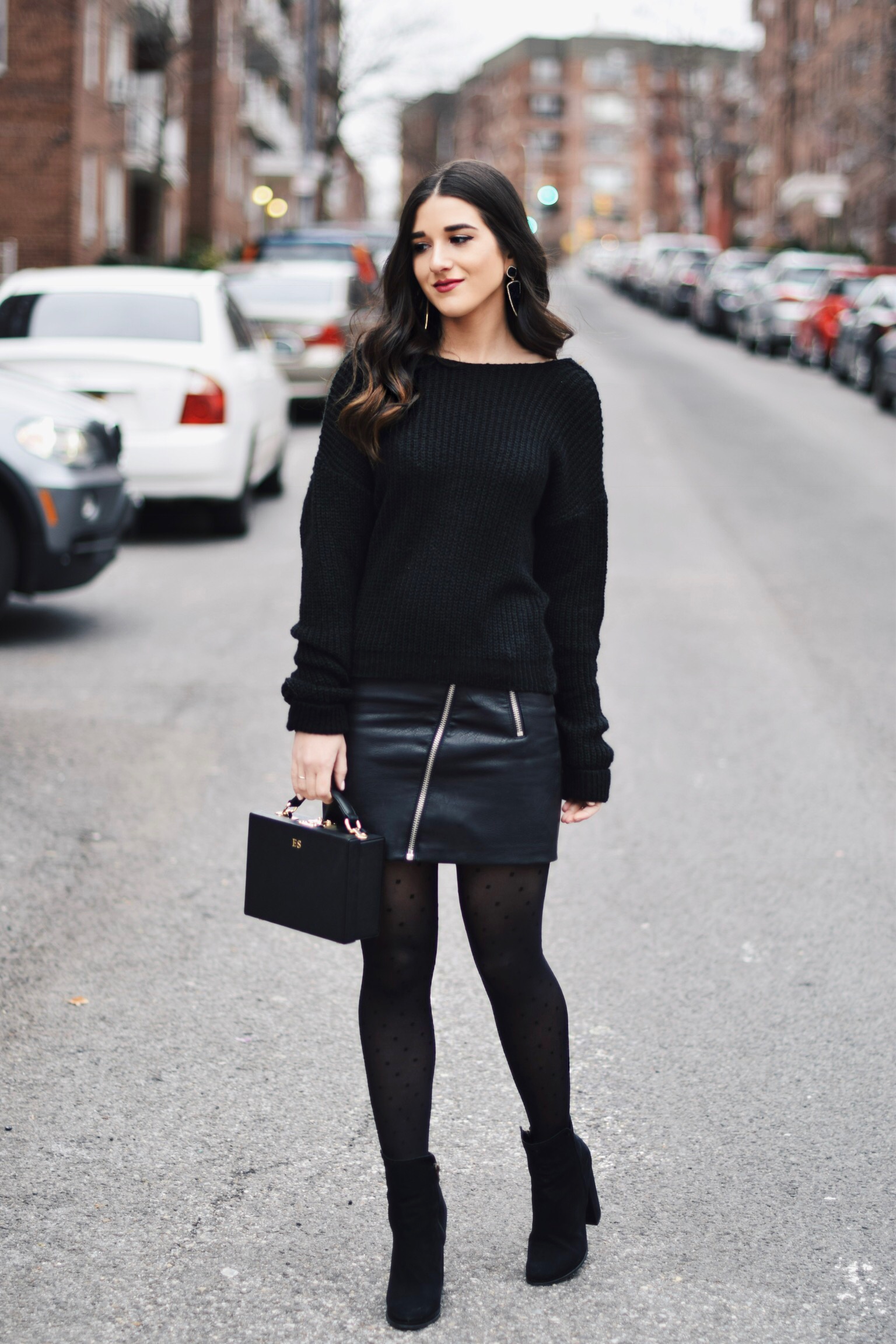 All Black Look 5 Ways To Keep Your New Year's Resolution Going Strong Esther Santer Fashion Blog NYC Street Style Blogger Outfit OOTD Trendy BaubleBar Earrings Monogrammed Box Bag Daily Edited  Girl Women Booties Pleather Mini Skirt Polka Dot Tights.jpg