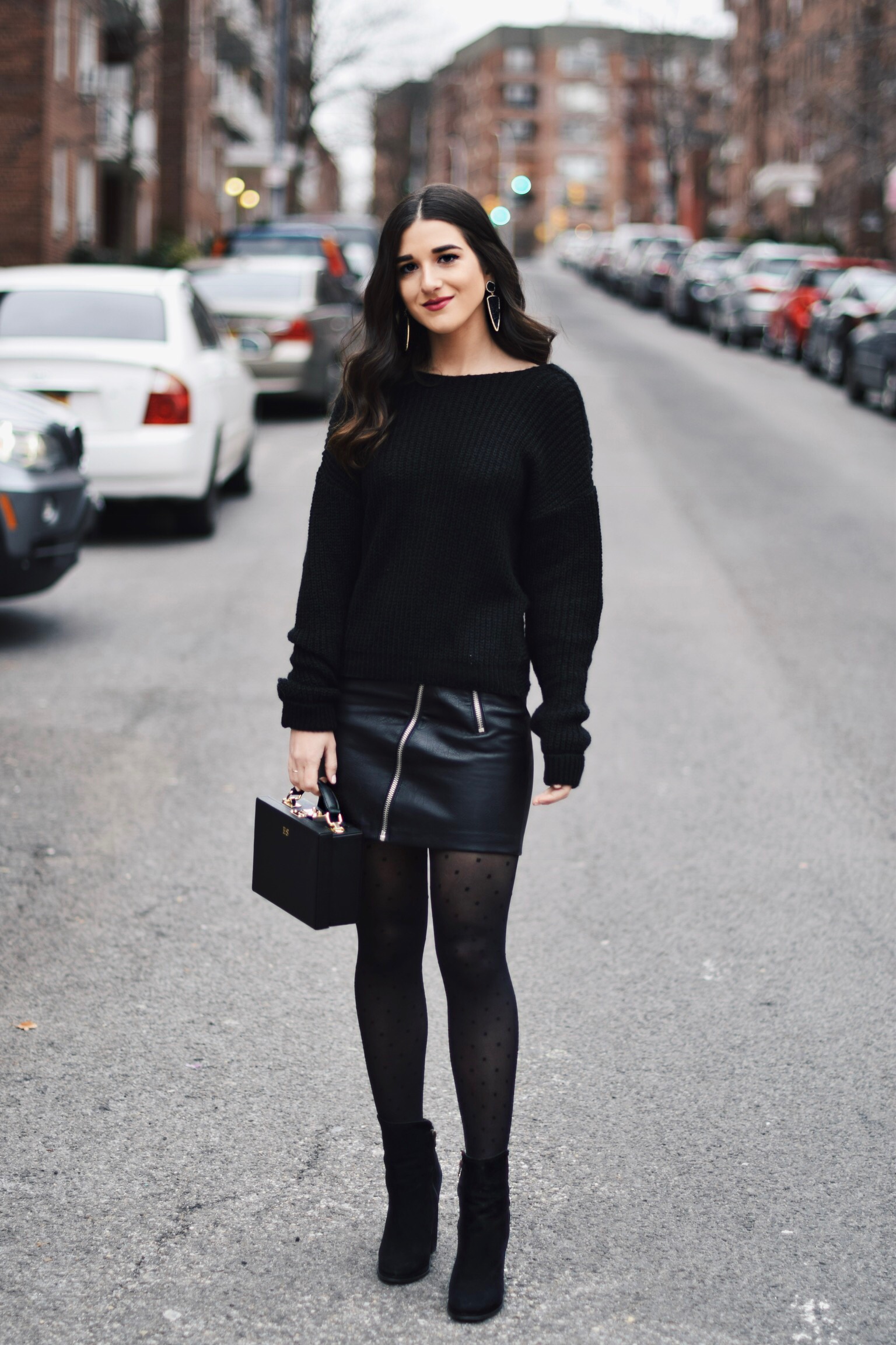 All Black Look 5 Ways To Keep Your New Year's Resolution Going Strong Esther Santer Fashion Blog NYC Street Style Blogger Outfit OOTD Trendy BaubleBar Earrings Monogrammed Box Bag Daily Edited Girl Women Booties Pleather Mini Skirt Polka Dot Tights.jpg