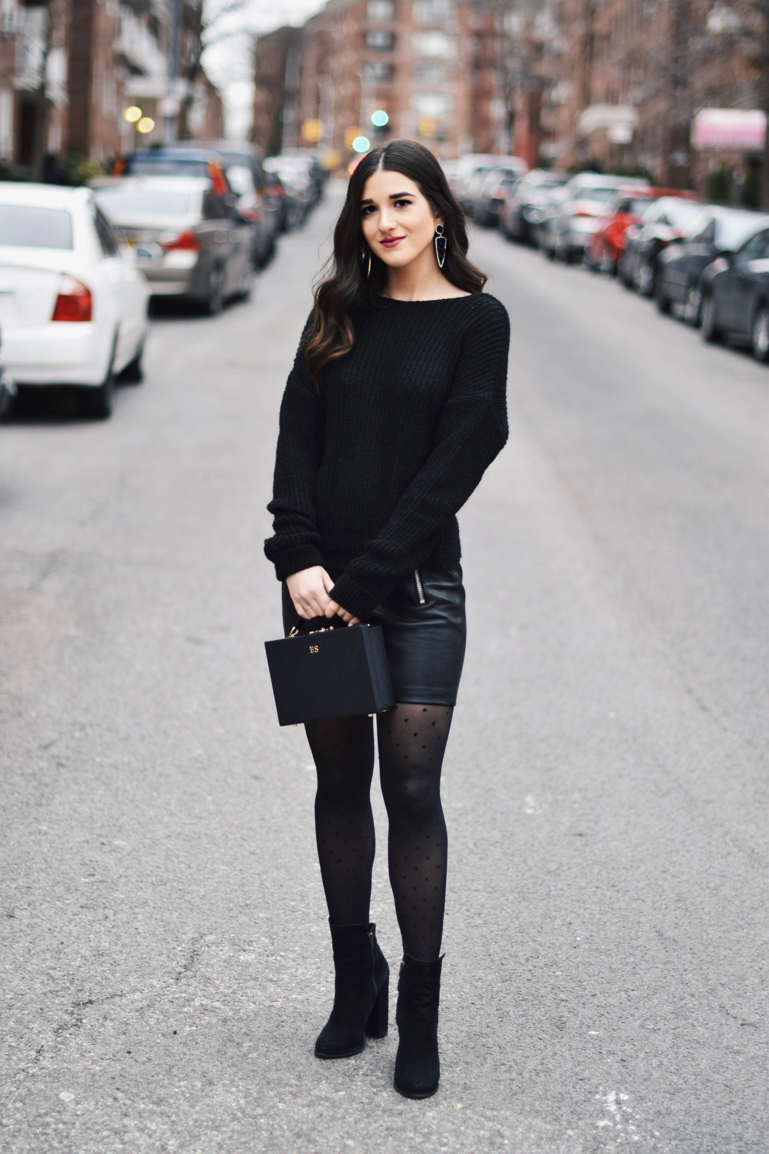 All Black Look 5 Ways To Keep Your New Year's Resolution Going Strong Esther Santer Fashion Blog NYC Street Style Blogger Outfit OOTD Trendy BaubleBar Earrings Monogrammed Box Bag Daily Edited Girl Women Booties Pleather Mini  Skirt Polka Dot Tights.jpg