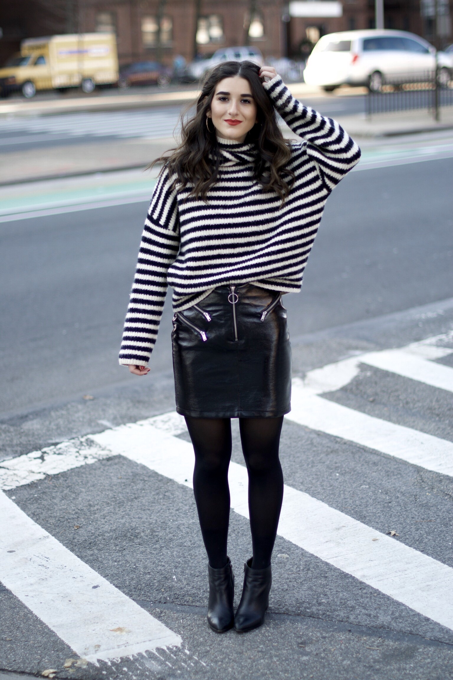 Striped Turtleneck Sweater + Pleather Skirt The Right Way To Ask Someone To Meet For Coffee Esther Santer Fashion Blog NYC Street Style Blogger Outfit OOTD Trendy Girl Women Black White Tights Ankle Booties  Winter Hoops Earrings Wavy Hair Shop Shoes.jpg