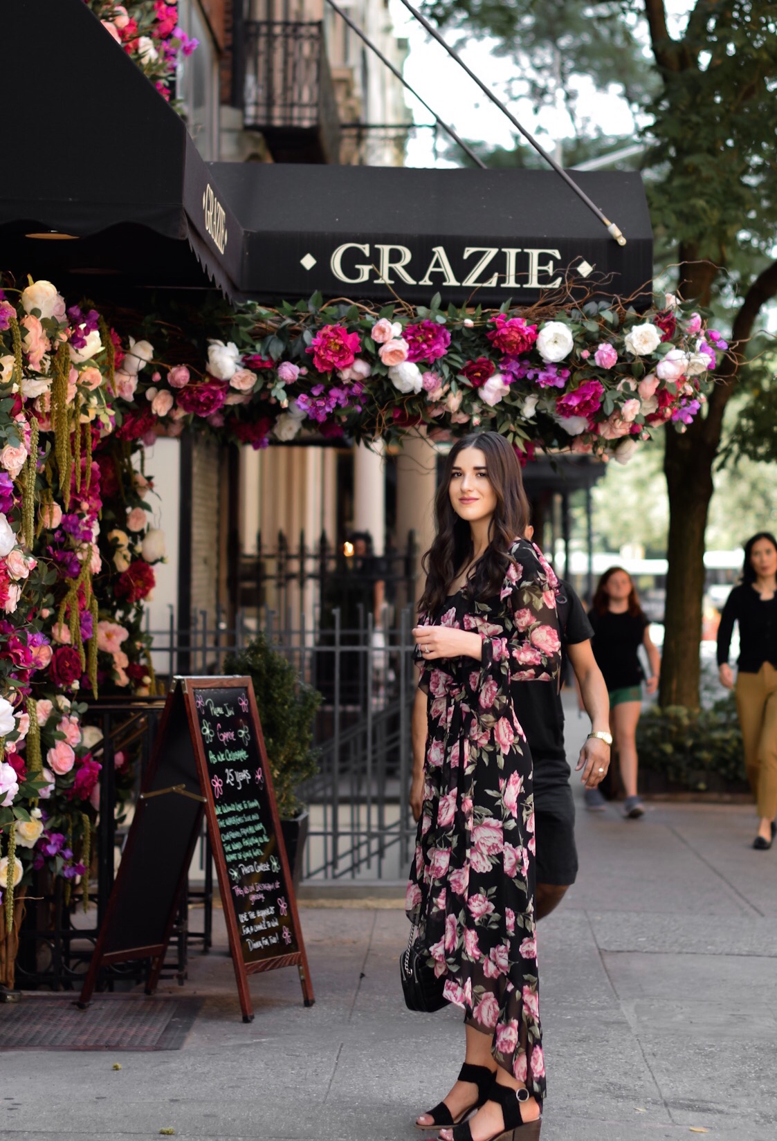 Why I'll Be Sitting Out My 11th Season Of NYFW Floral Maxi Wrap Dress Esther Santer Fashion Blog NYC Street Style Blogger Outfit OOTD Trendy ASOS Vince Camuto Black Braided Sandals Summer Look Floral Backdrop New York City Upper East Side  Photoshoot.jpg