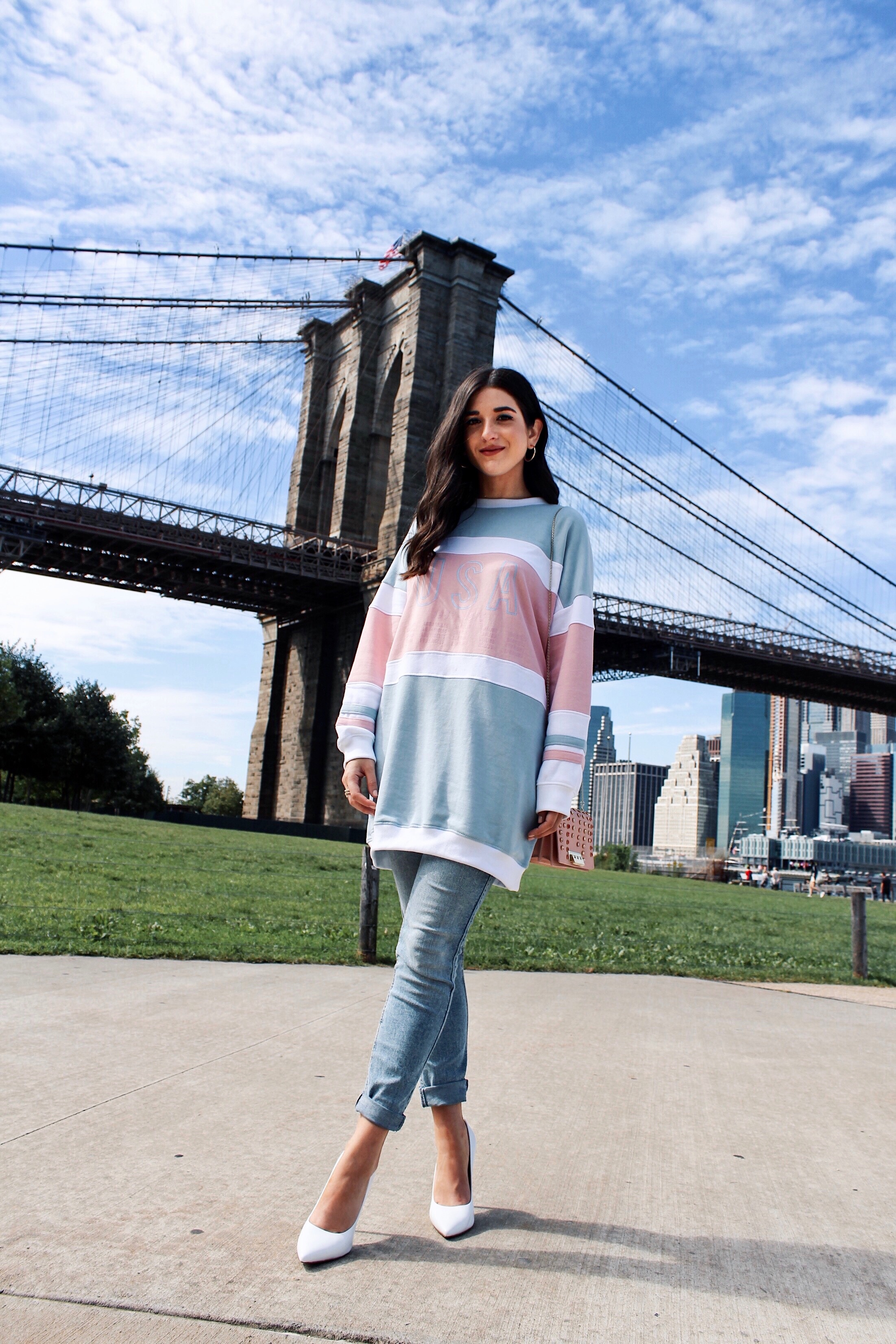 How To Style Kenneth Cole's White Riley Heels Esther Santer Fashion Blog NYC Street Style Blogger Outfit OOTD Trendy Brand Collaboration Comfortable Casual Wear Jeans Oversized Sweatshirt Pink Zac Posen Bag Girl Women  Dumbo Photoshoot Carousel Bridge.jpg