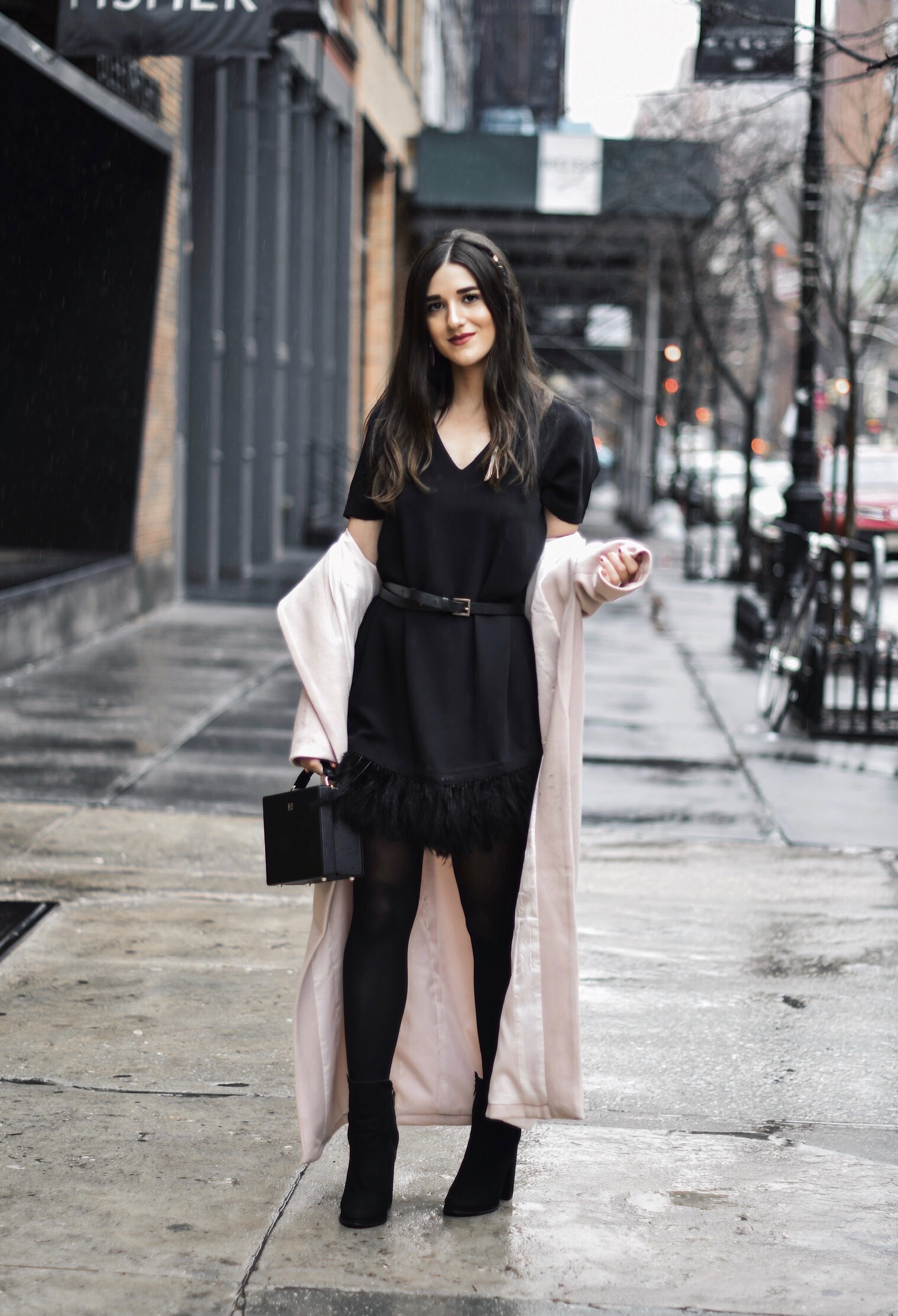 How To Stay Grounded Black Feather Trim Dress Long Pink Coat Esther Santer Fashion Blog NYC Street Style Blogger Outfit OOTD Trendy Saks Off 5th Feather Trim Dress Black Tights Booties M4D3 Shoes ASOS Belt Blush Box Clutch Bag Shop  Wear Cozy Winter.jpg