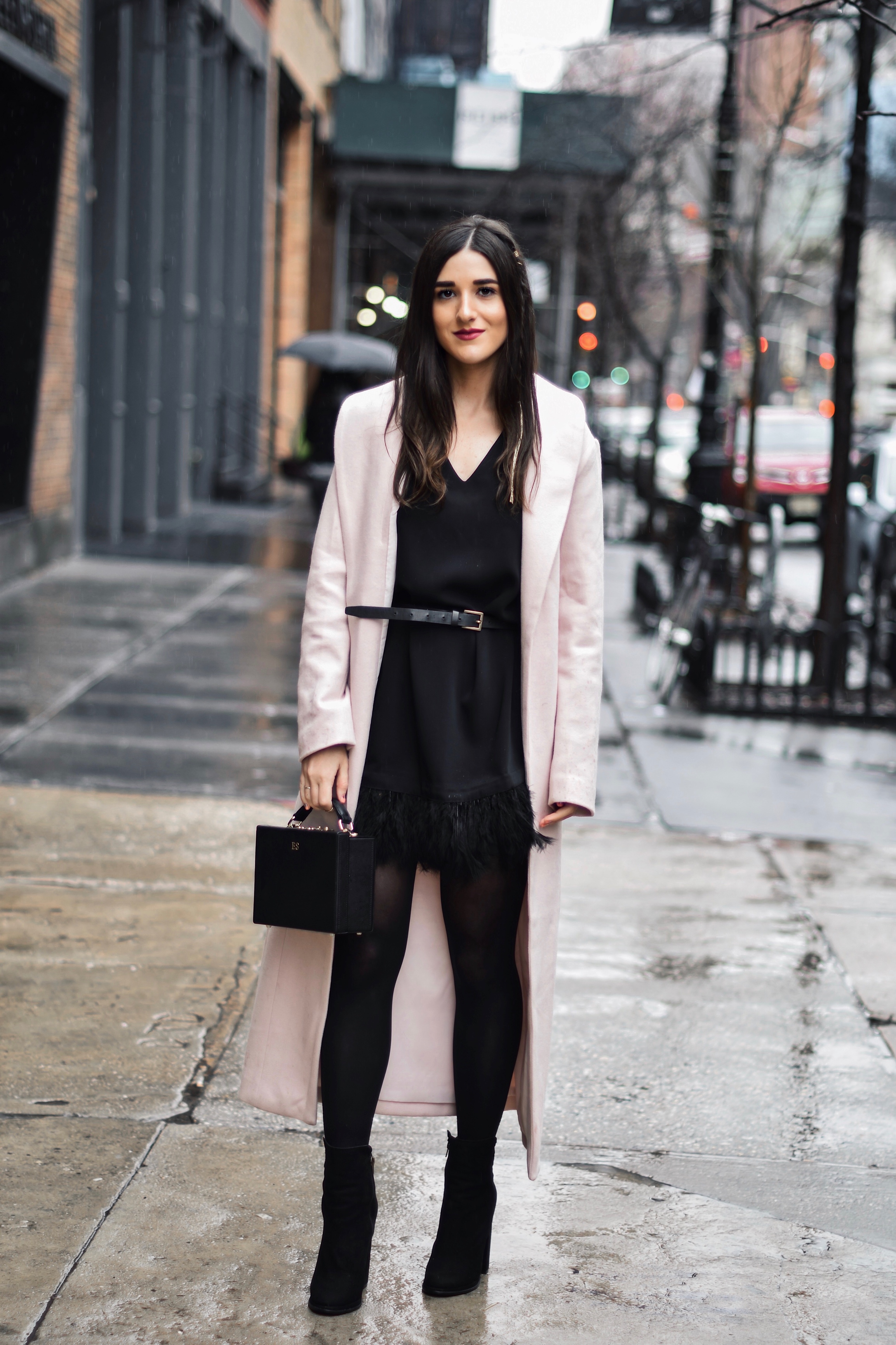 How To Stay Grounded Black Feather Trim Dress Long Pink Coat Esther Santer Fashion Blog NYC Street Style Blogger Outfit OOTD Trendy Saks Off 5th Feather Trim Dress Black Tights Booties M4D3 Shoes ASOS Belt Blush  Box Clutch Bag Shop Wear Cozy Winter.jpg