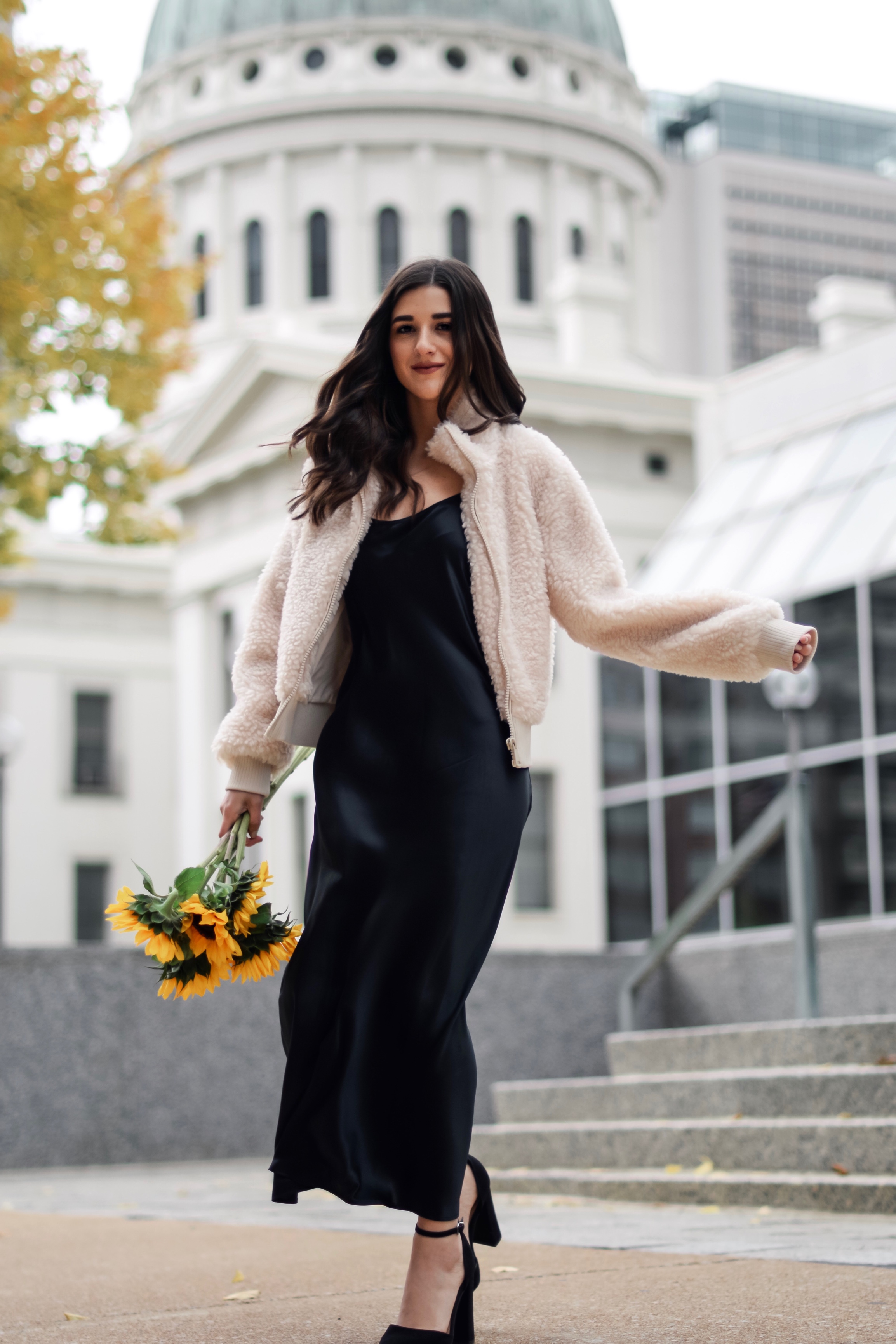 The 10 Most Frustrating Parts Of Brand Collabs Long Black Slip Dress Shearling Jacket Esther Santer Fashion Blog NYC Street Style Blogger Outfit OOTD  Trendy Shopping St. Louis Photoshoot Hometown Downtown Saint Louis Sunflowers Yellow Flowers Heels.jpg