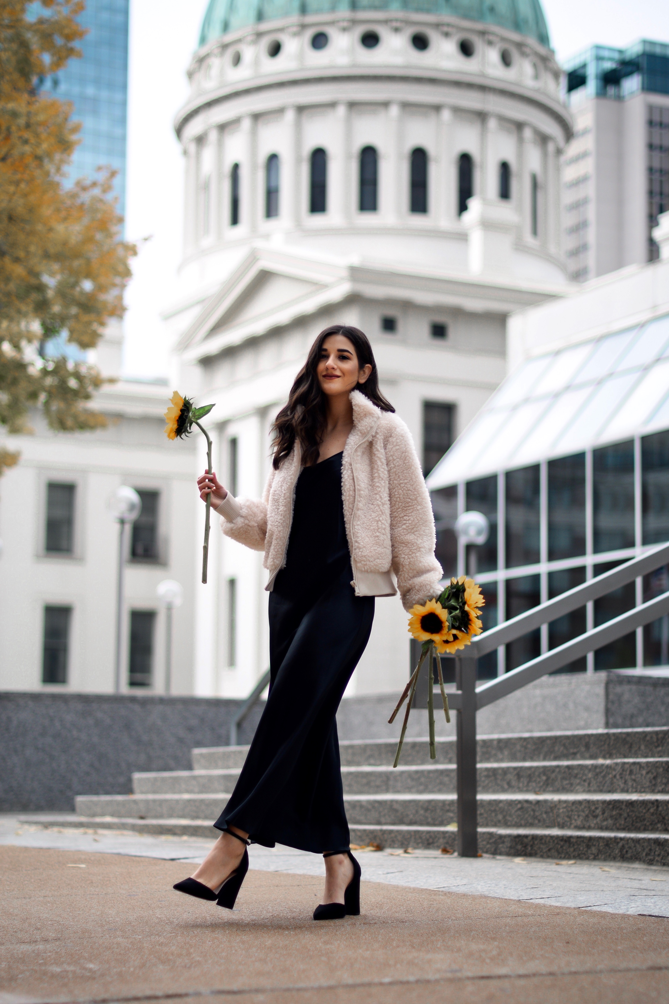 The 10 Most Frustrating Parts Of Brand Collabs Long Black Slip Dress Shearling Jacket Esther Santer Fashion Blog NYC Street Style Blogger Outfit OOTD Trendy Shopping St. Louis Photoshoot Hometown  Downtown Saint Louis Sunflowers Yellow Flowers Heels.jpg