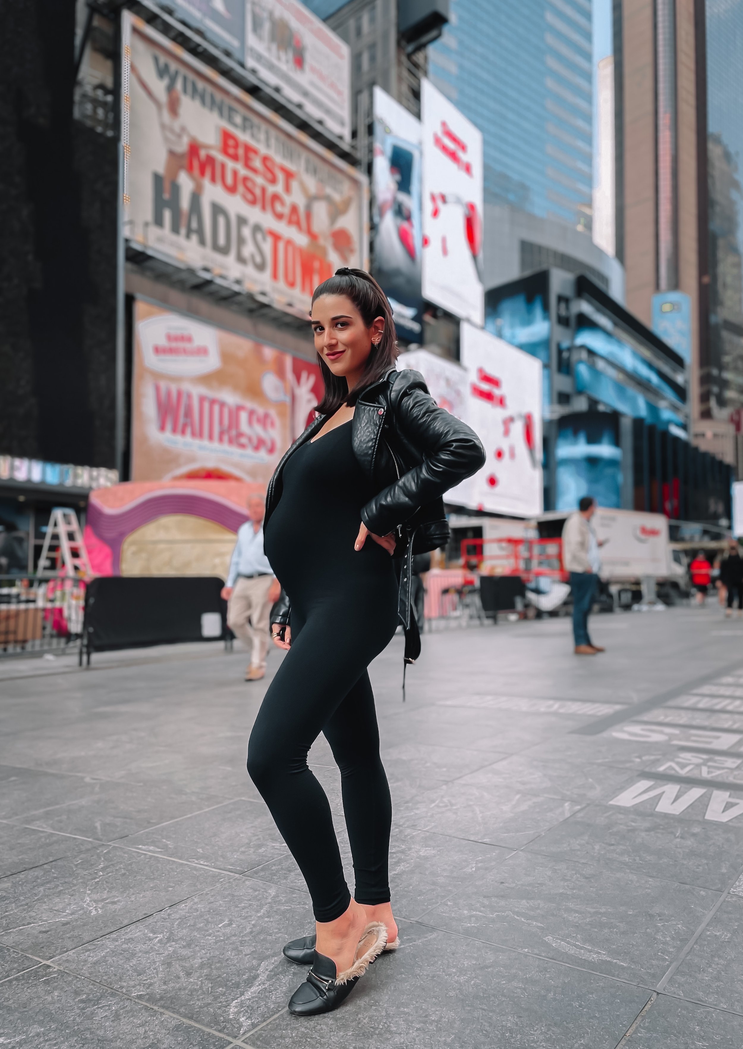Ribbed Black Jumpsuit Leather Jacket Esther Santer NYC Street Style Blogger Pregnancy Style Maternity Fashion Bump Styled Bumpdate Hatch Unitard Target Fur Slides Expecting Mom What To Wear Shopping All Black Outfit OOTD Times Square NYC Tripod Photo.JPG