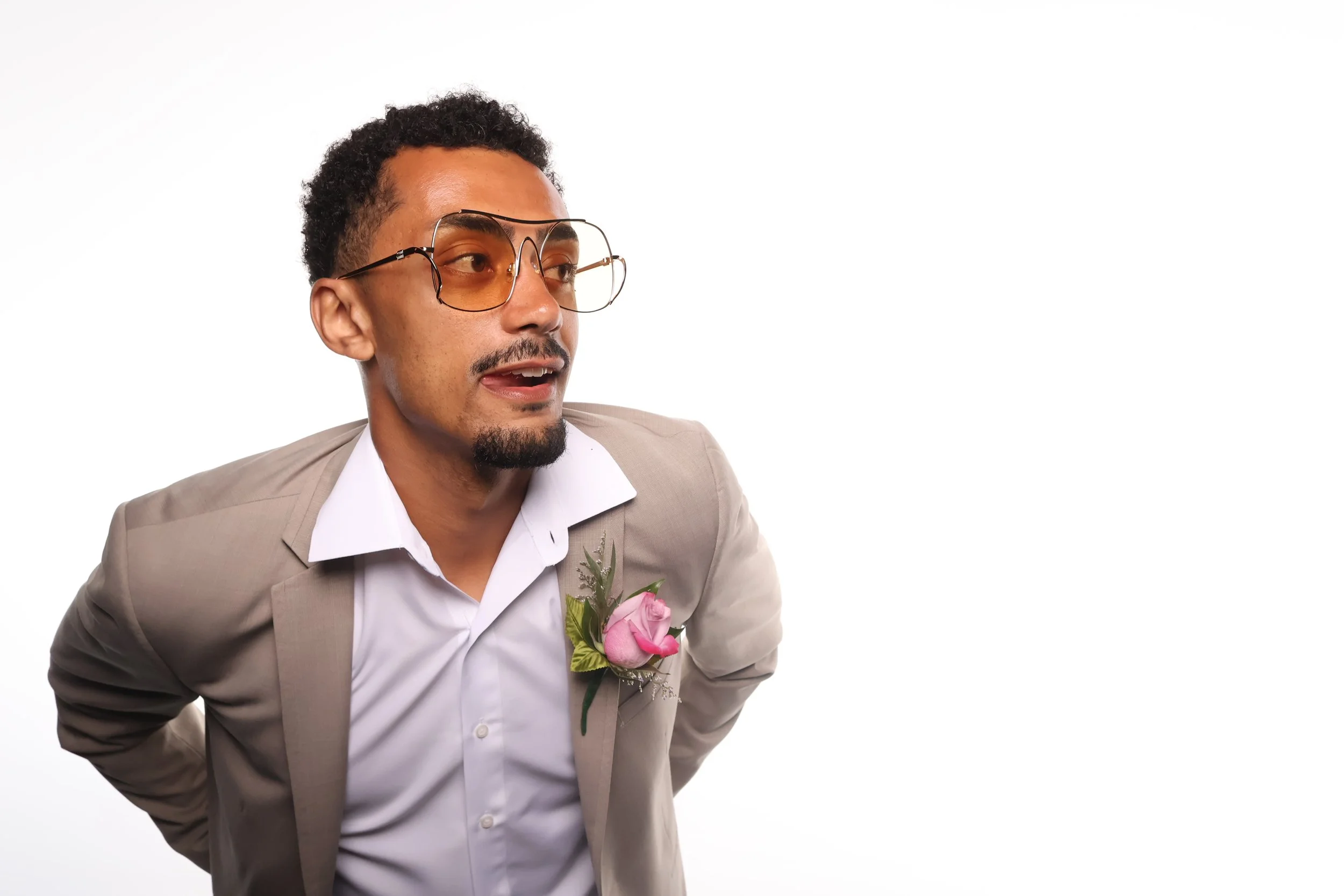A suave frenchman posing in the photo booth