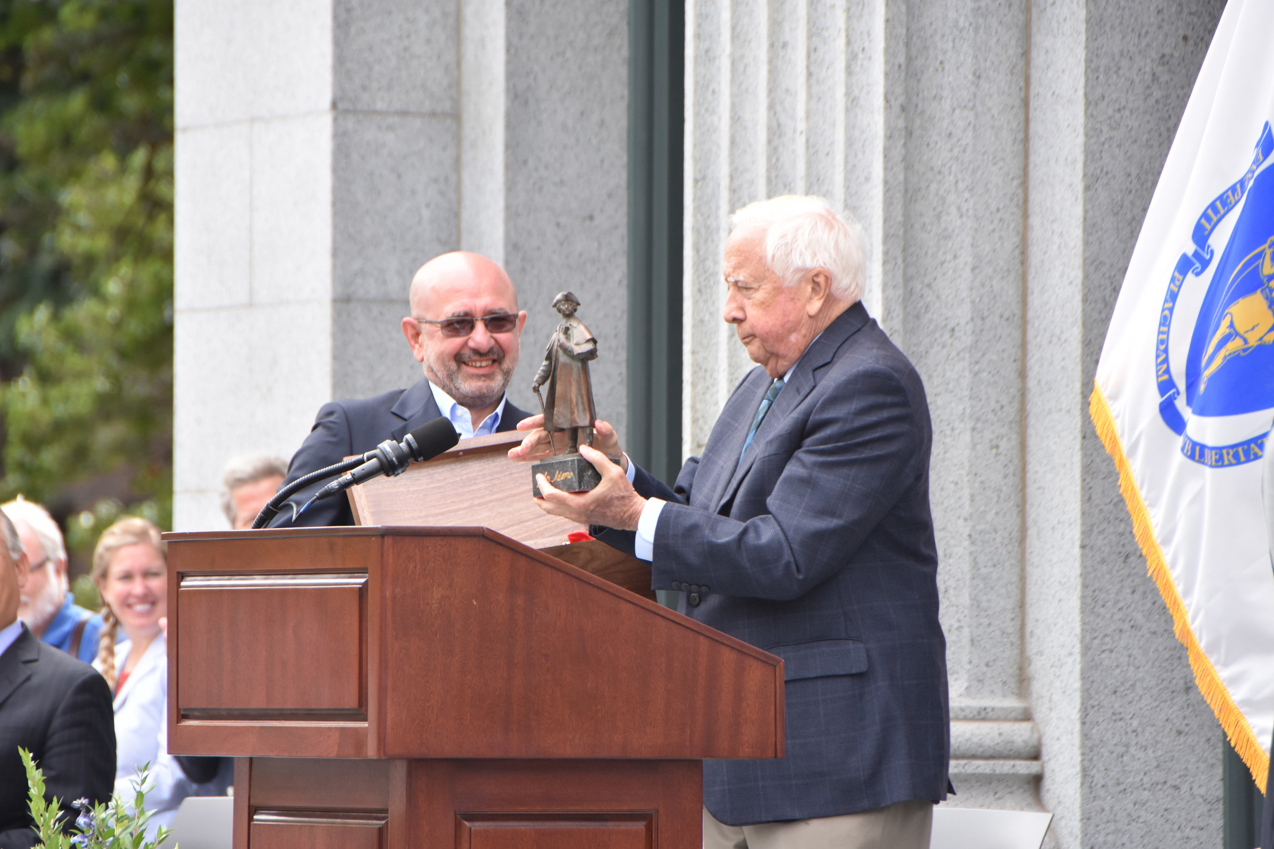  Artist Sergey Eylanbekov presents David McCullough with a replica of the John Adams statue 