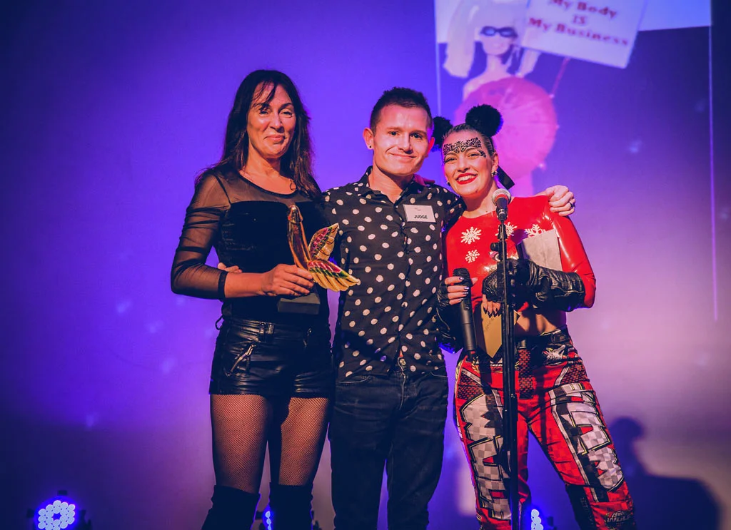 Sexual_Freedom_Awards_2016-SCOT-PEP_(Activist_Winner)-Alex_Feis-Bryce_(judge)-Alix_Fox_(compere)-Trophy_presentation-Copyright+Credit_Gina_Jackson-(025aw).jpg