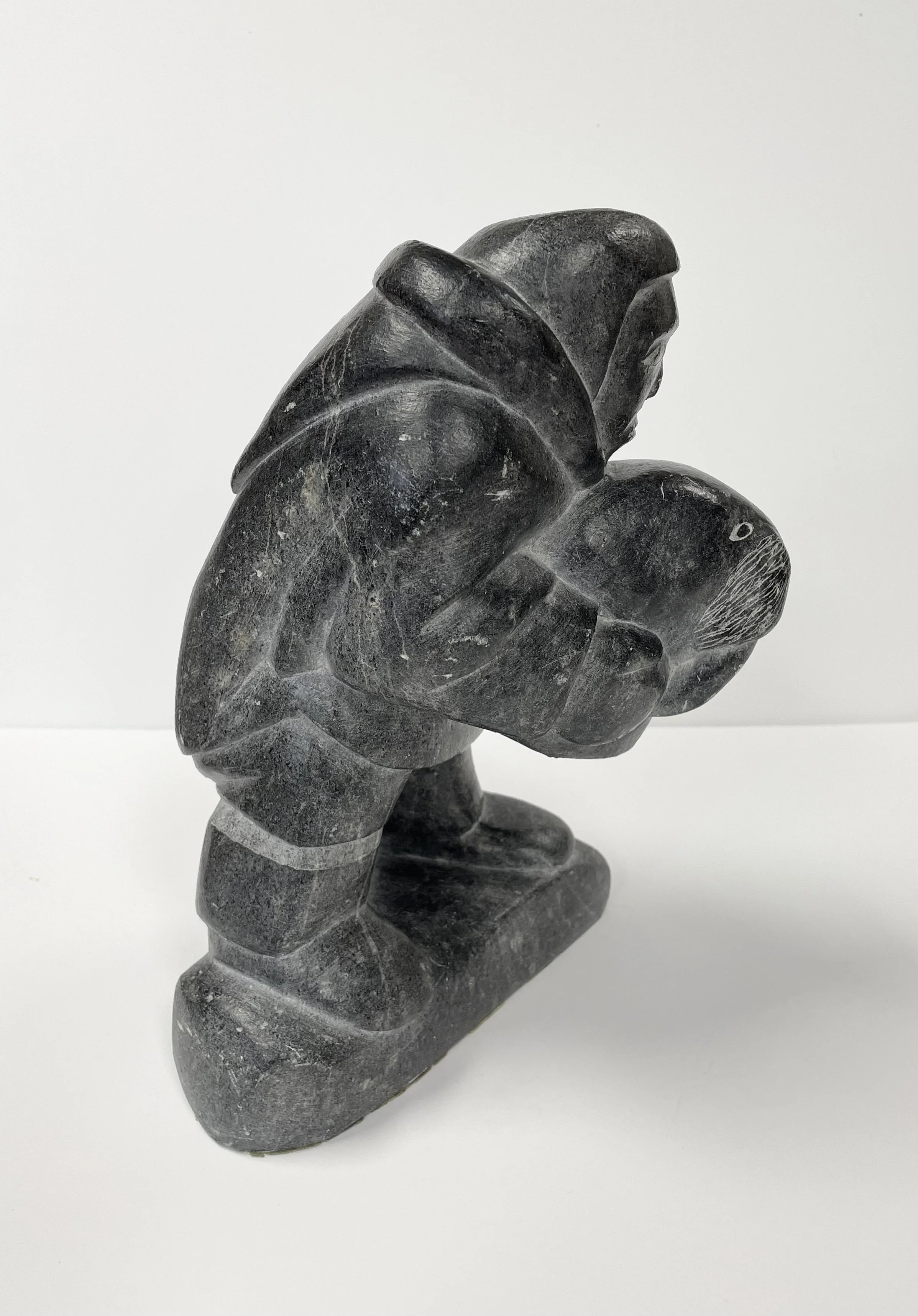 Unidentified, Hunter Holding Walrus Head, stone, 10.5x7x7 -2.jpg