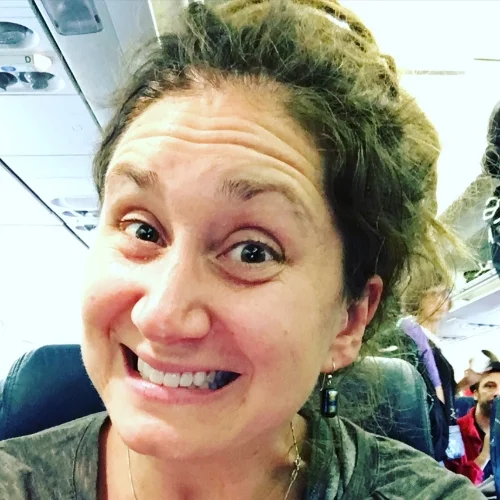Happy on the flight...they let me keep my guitar with me. That ALWAYS makes me happy.