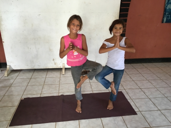 Paula and Aymi sharing my mat for tree pose.