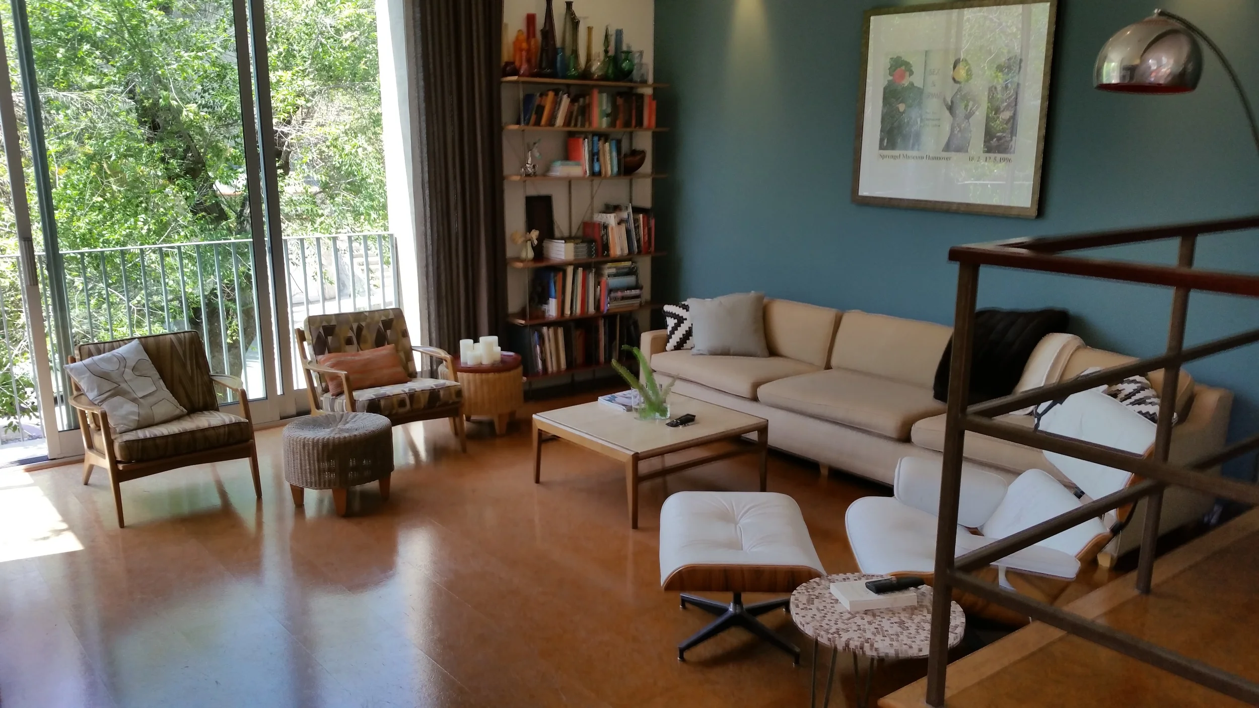 Located in the hills south of Sunset Jumction is this Silver Lake Tradional-Home with mid-century accents. The street below these sliding glass doors is a quiet cul de sac called Kodak Drive so these windows can be left open and still feel secluded.