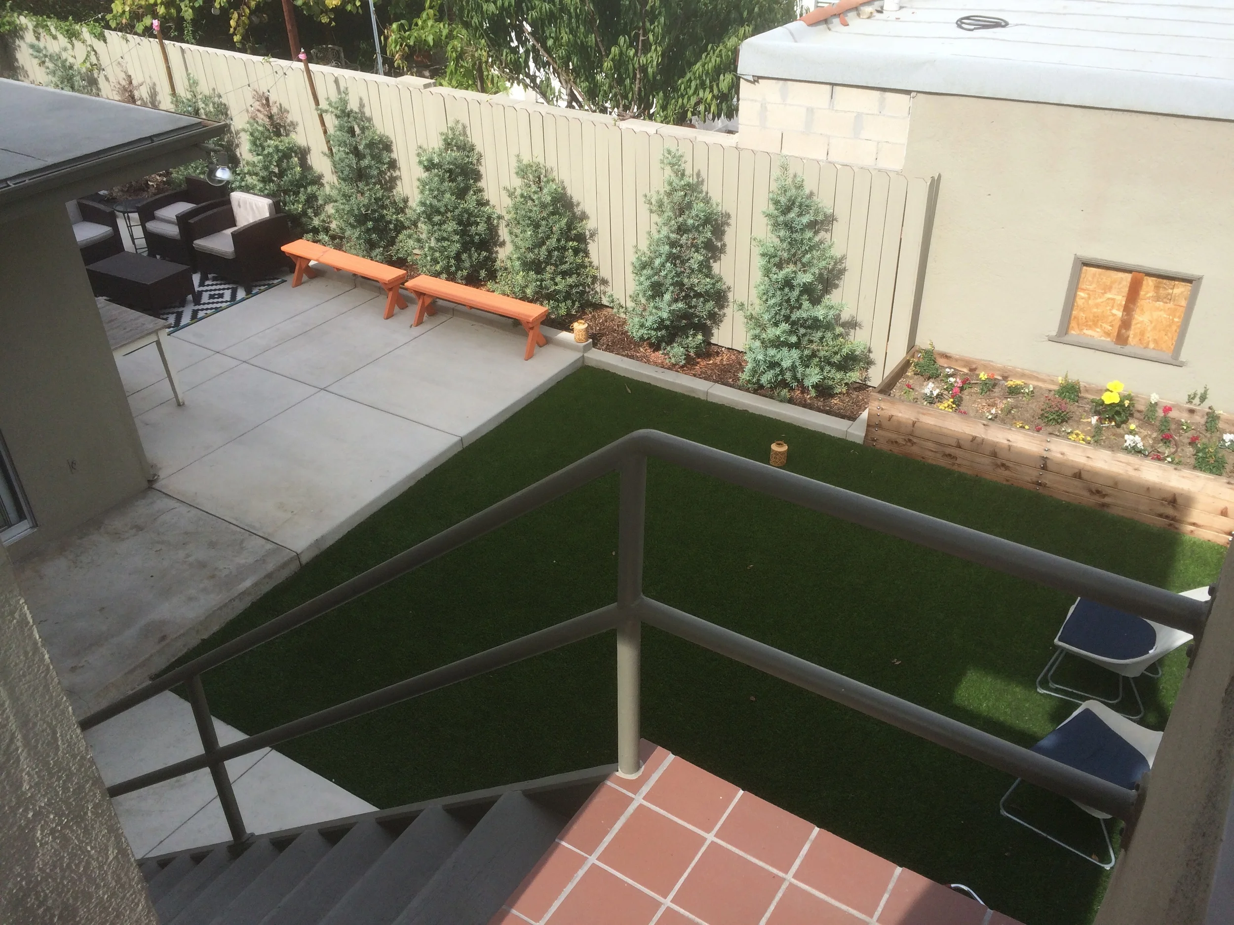 View of shared rear yard from upstairs landing.