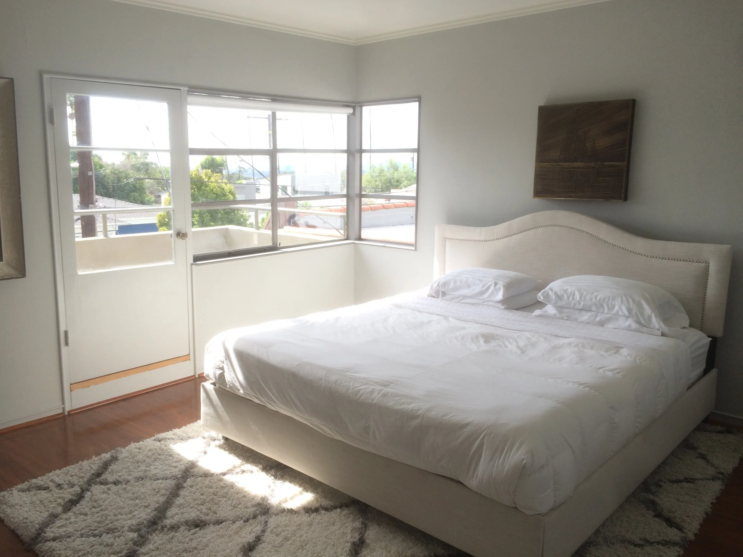 upstairs bedroom with south facing balcony.