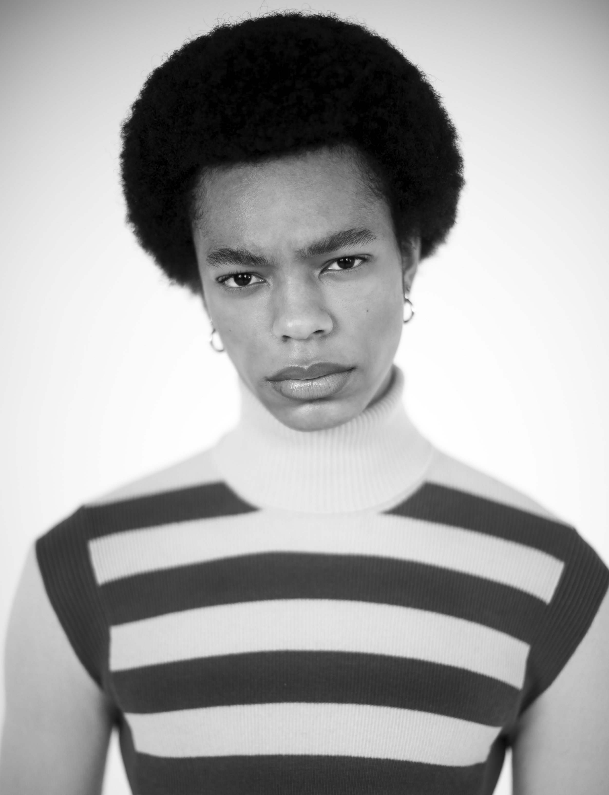 Justin Xavier wearing Prada