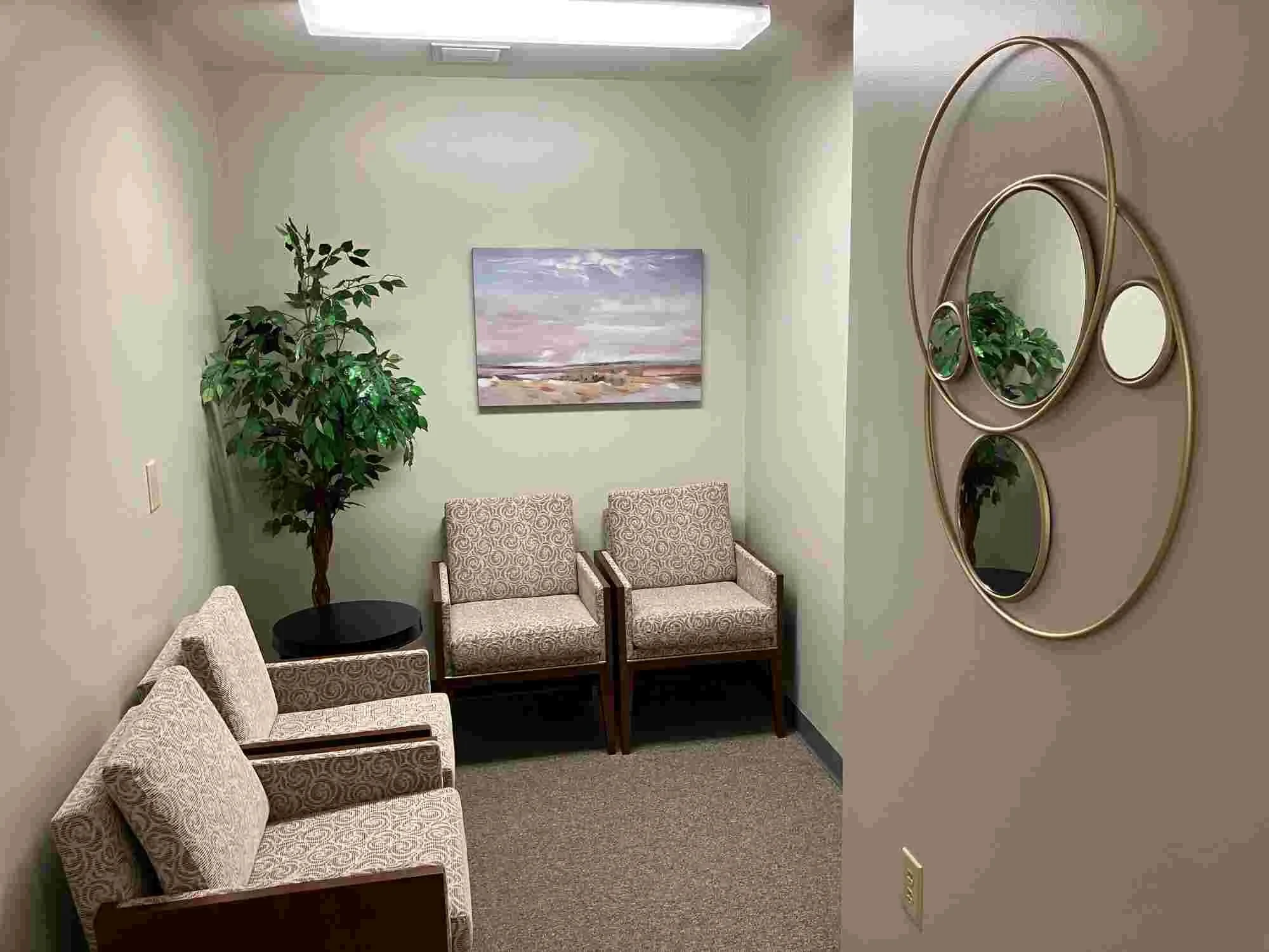 4 chairs in waiting area off office