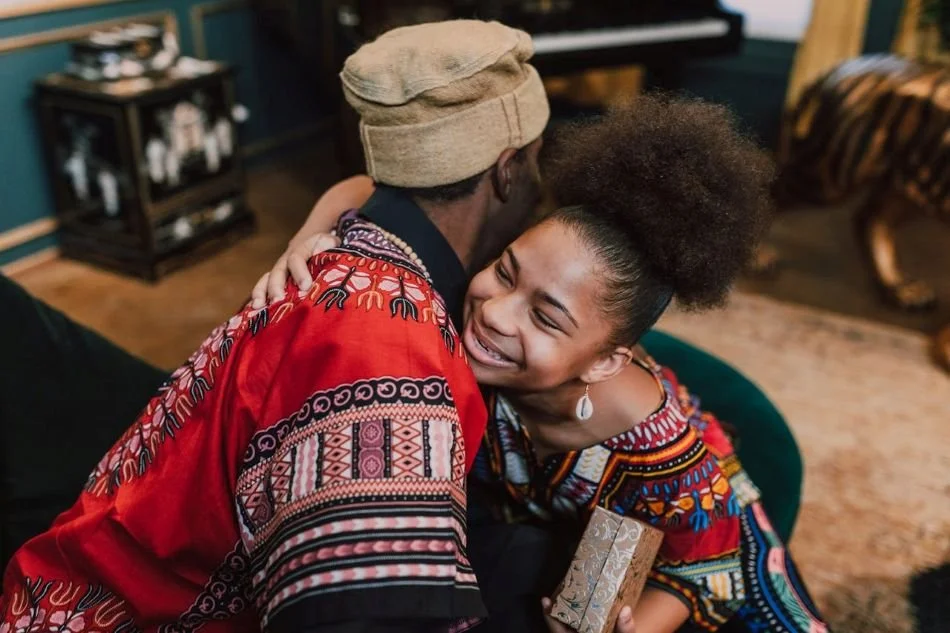 Woman hugging man after receiving gift