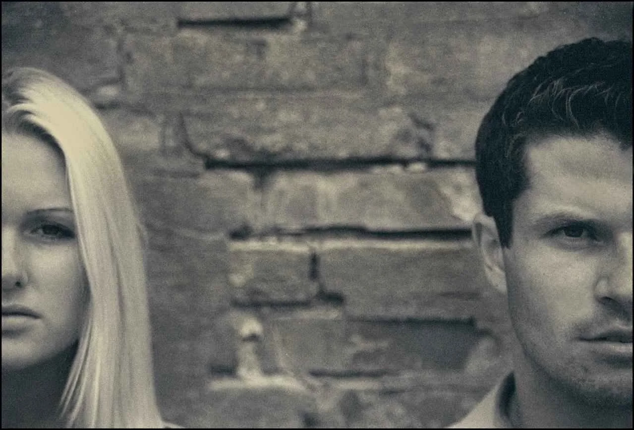woman and man standing next to each other