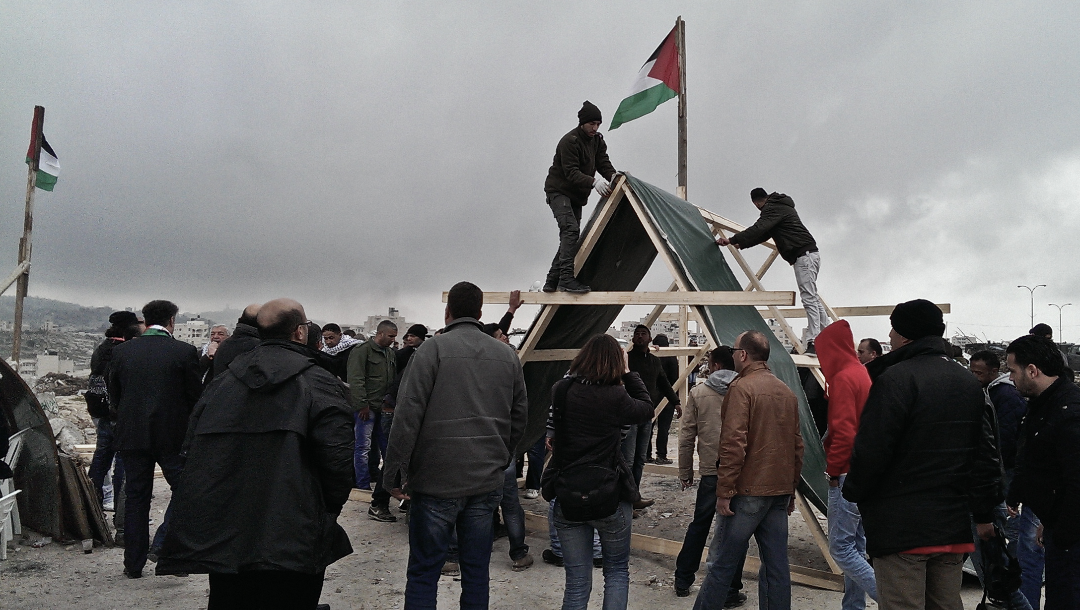Residents of Abu Dis erect a tent in 'Bawabet al-Quds' to signal that they want to decide who lives and builds in the village's land. Feb 16, 2015 ©Lena Odgaard