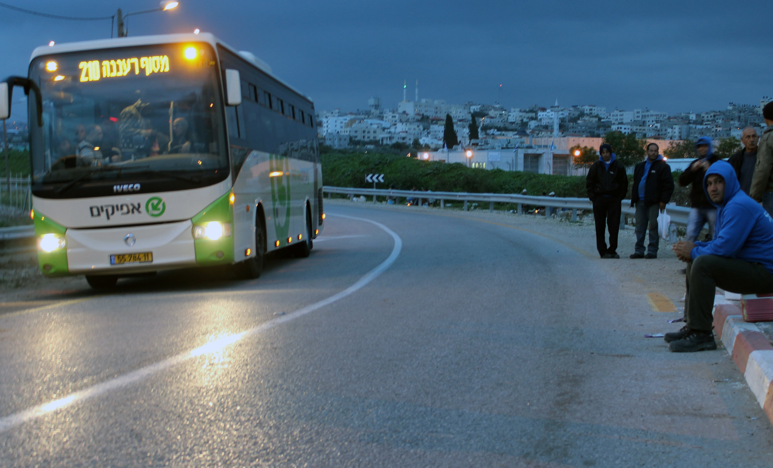 20130305 - Palestinian worker wait for bus2.jpg