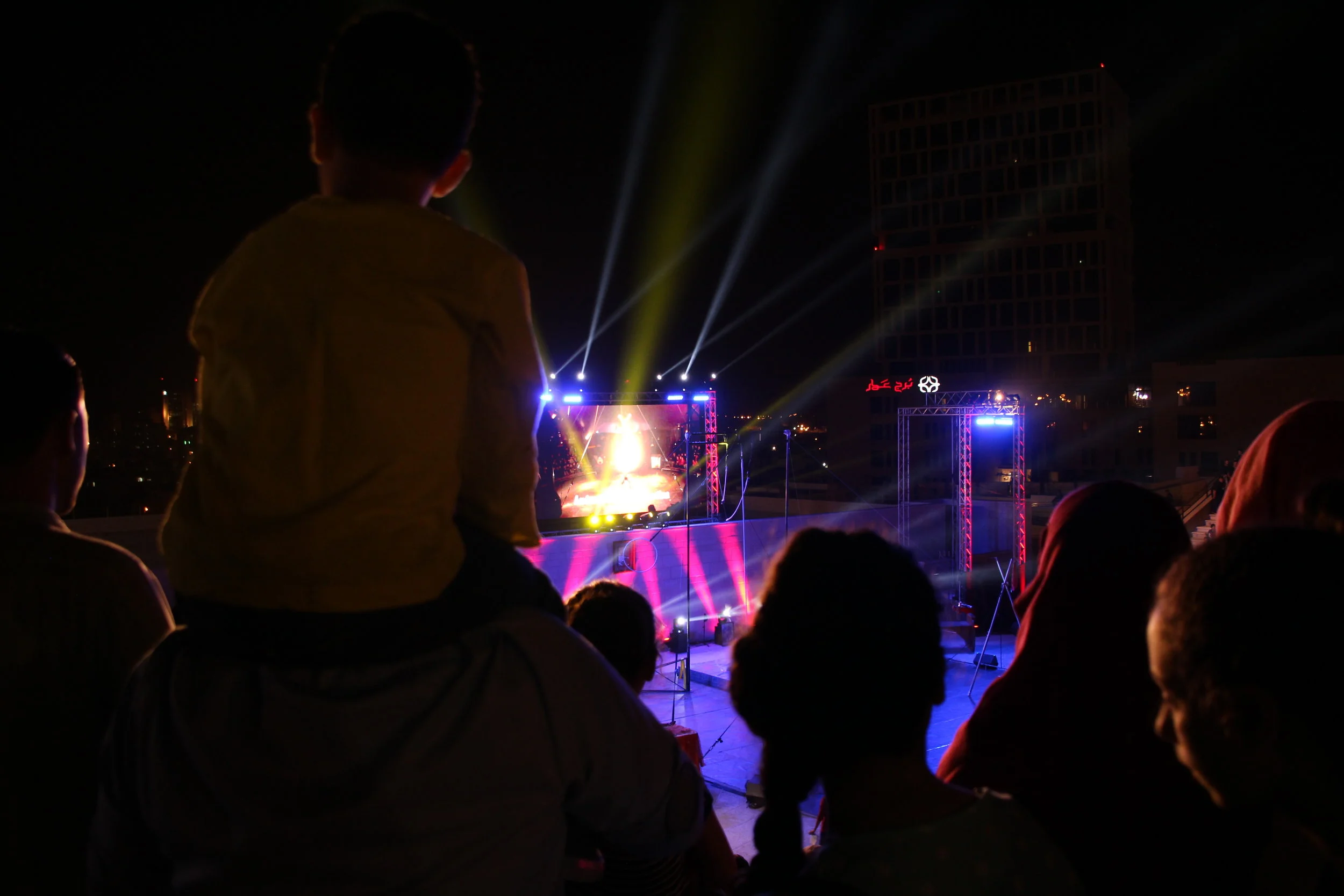 boy on shoulders at Circus festival.JPG
